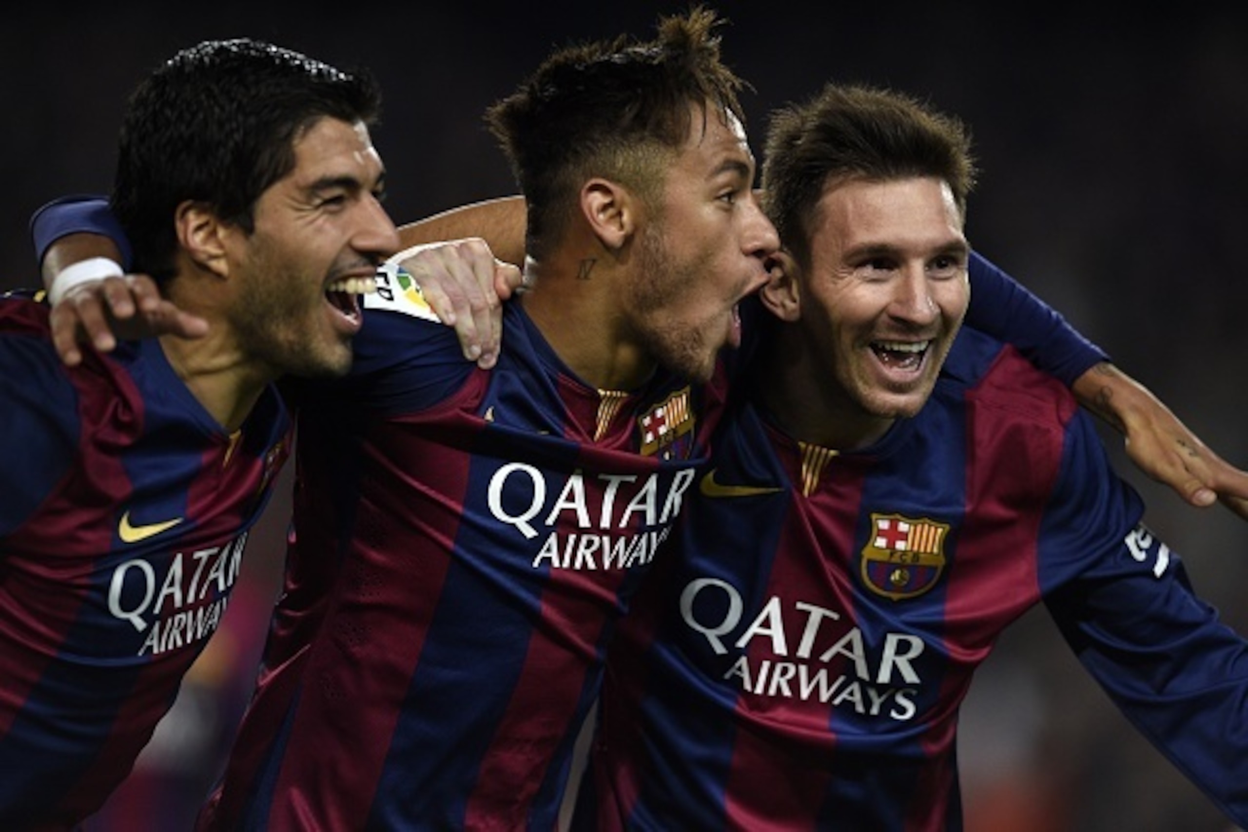 Barcelona's Argentinian forward Lionel Messi, Barcelona's Brazilian forward Neymar da Silva Santos Junior and Barcelona's Uruguayan forward Luis Suarez celebrate during the Spanish league football match FC Barcelona vs Club Atletico de Madrid at the Camp 