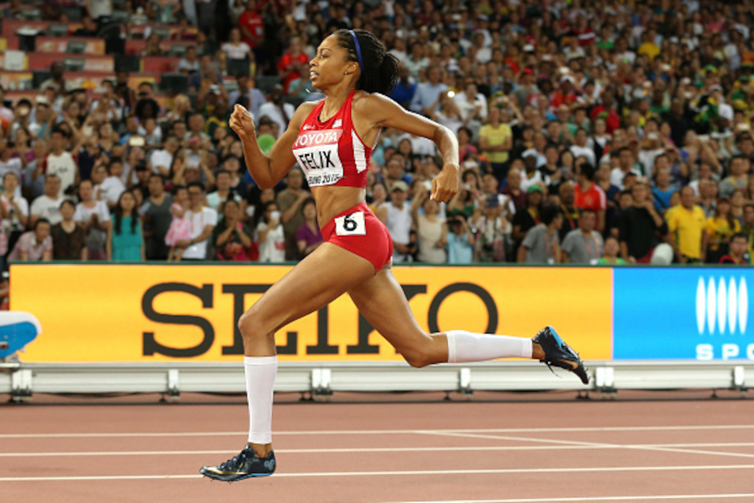 BEIJING, CHINA - AUGUST 27:  Allyson Felix of the United States on her way to winning gold in the Women's 400 metres Final during day six of the 15th IAAF World Athletics Championships Beijing 2015 at Beijing National Stadium on August 27, 2015 in Beijing