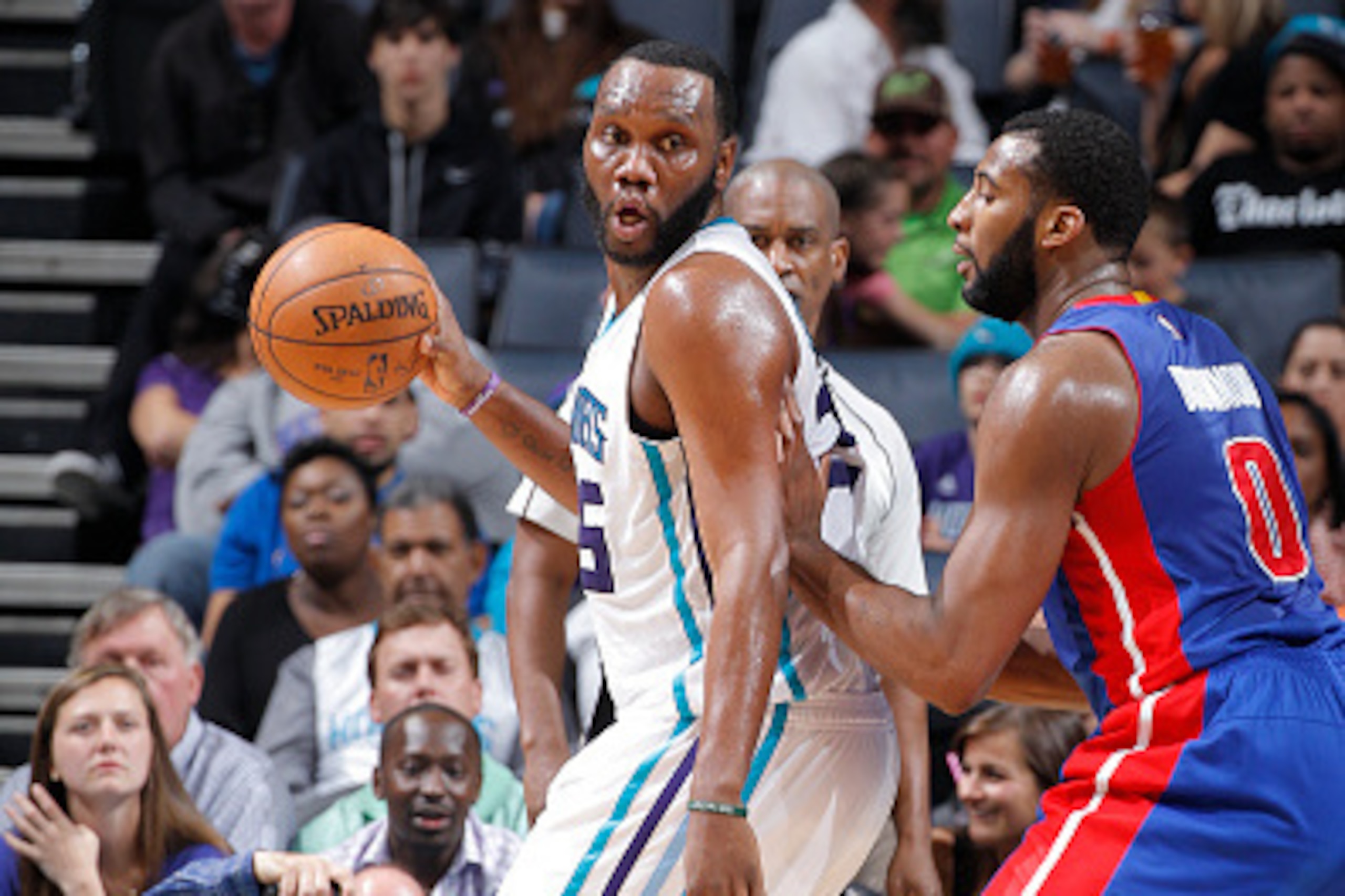 CHARLOTTE, NC - APRIL 1: Al Jefferson #25 of the Charlotte Hornets handles the ball against Andre Drummond #0 of the Detroit Pistons on April 1, 2015 at Time Warner Cable Arena in Charlotte, North Carolina. NOTE TO USER: User expressly acknowledges and ag