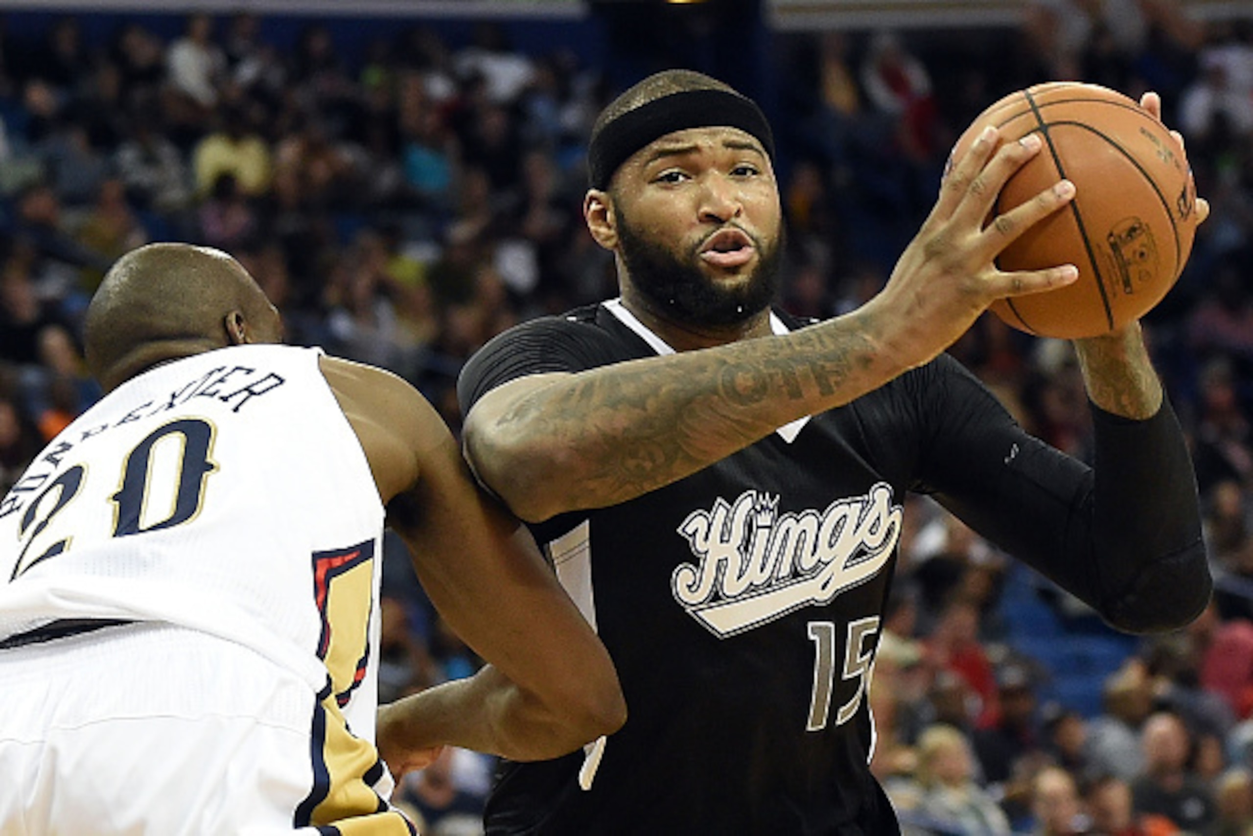 NEW ORLEANS, LA - MARCH 27:  DeMarcus Cousins #15 of the Sacramento Kings works against Quincy Pondexter #20 of the New Orleans Pelicans during a game at the Smoothie King Center on March 27, 2015 in New Orleans, Louisiana.  NOTE TO USER: User expressly a