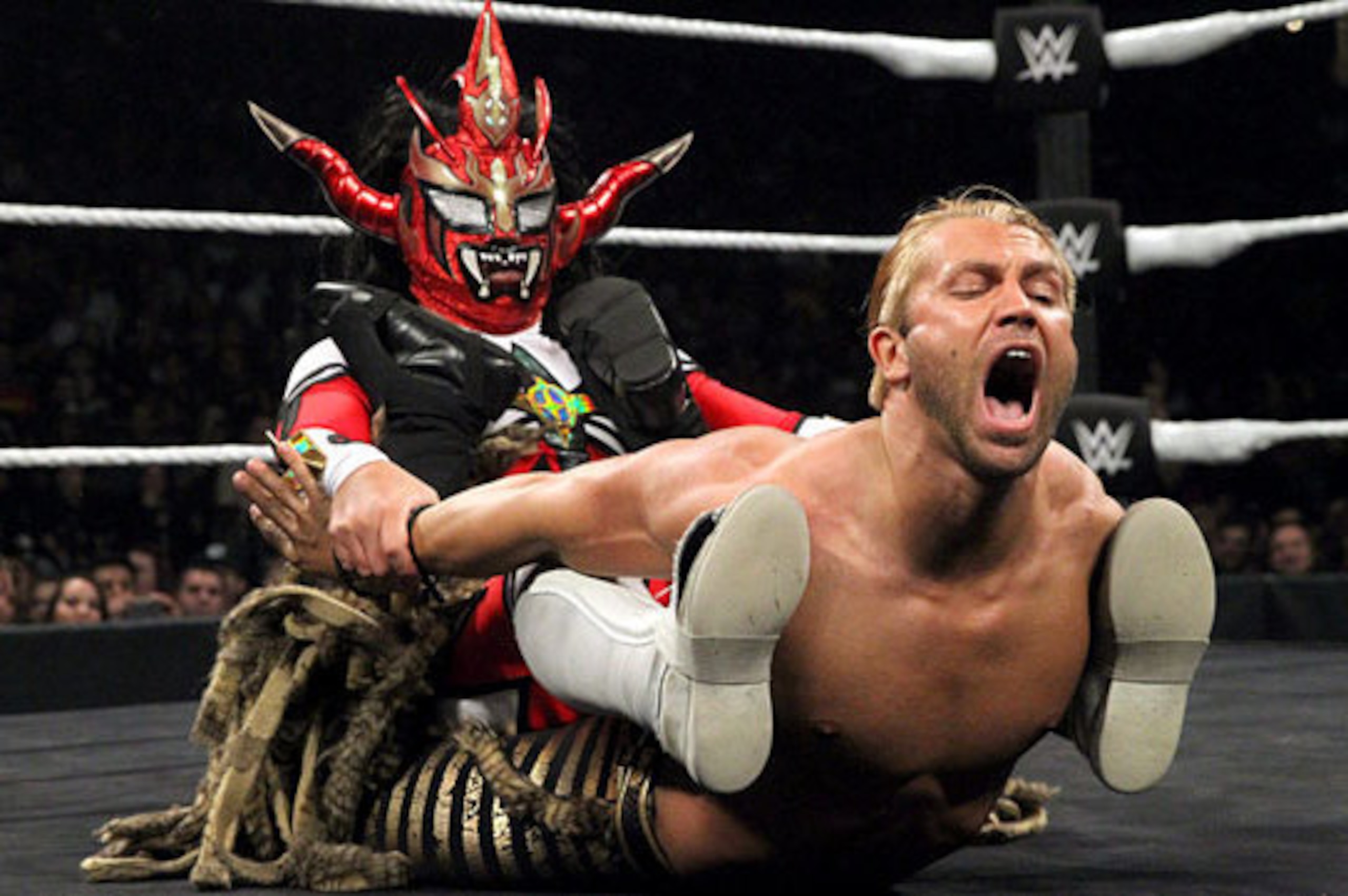 Jushin Liger puts the hurt on Tyler Breeze.