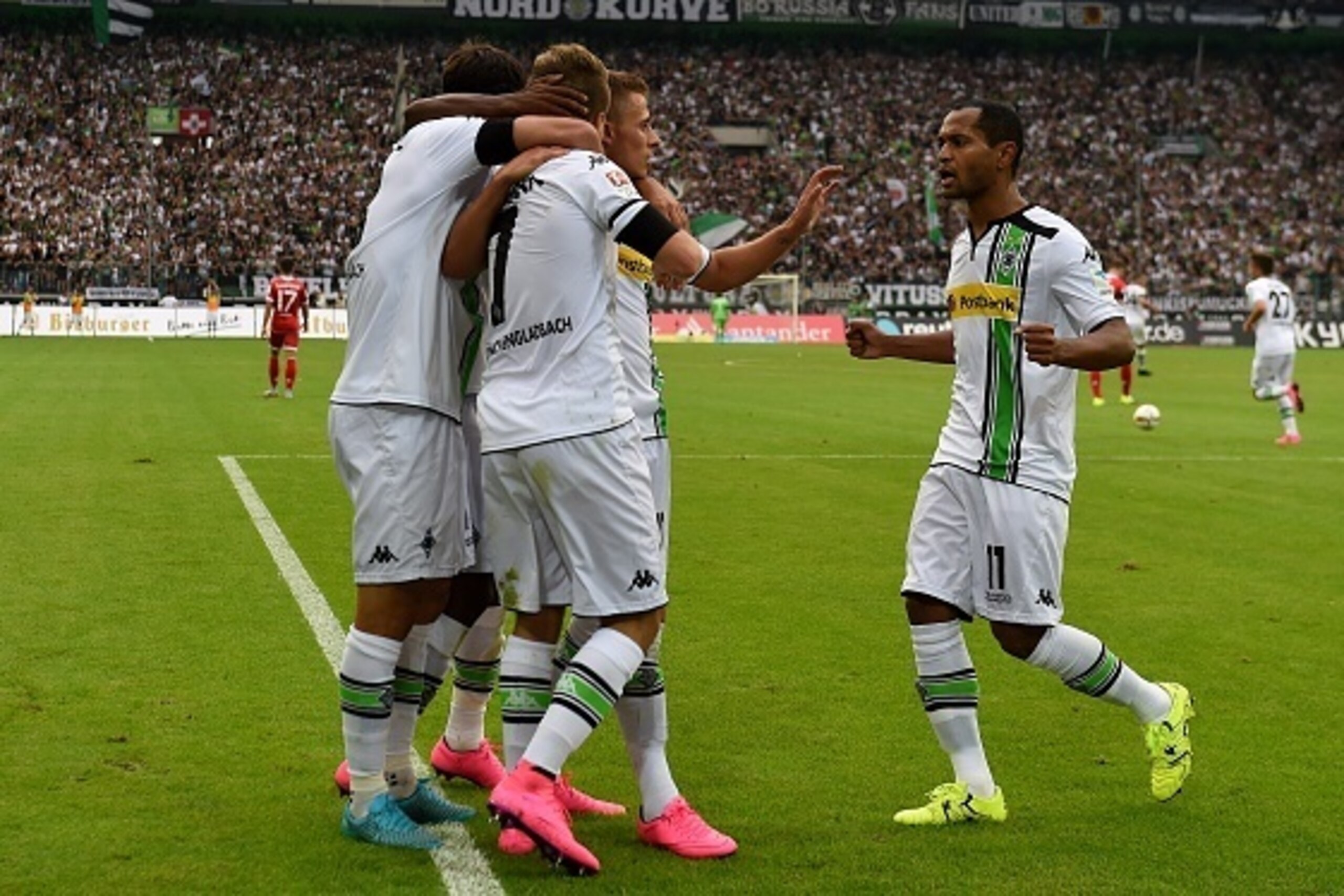 Moenchengladbach's Brazilian midfielder Raffael (R) and his teammates celebrate during the German first division Bundesliga football match Borussia Moenchengladbach vs FSV Mainz 05, on August 23, 2015 in Moenchengladbach, western Germany. Mainz wins 1-2. 