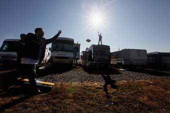 STATE COLLEGE, PA - NOVEMBER 12: A Penn State fan tosses beanbags at a tailgate party outside Beaver Stadium before the start of the Penn State vs. Nebraska NCAA football game in the wake of the Jerry Sandusky scandal on November 12, 2011 in State College