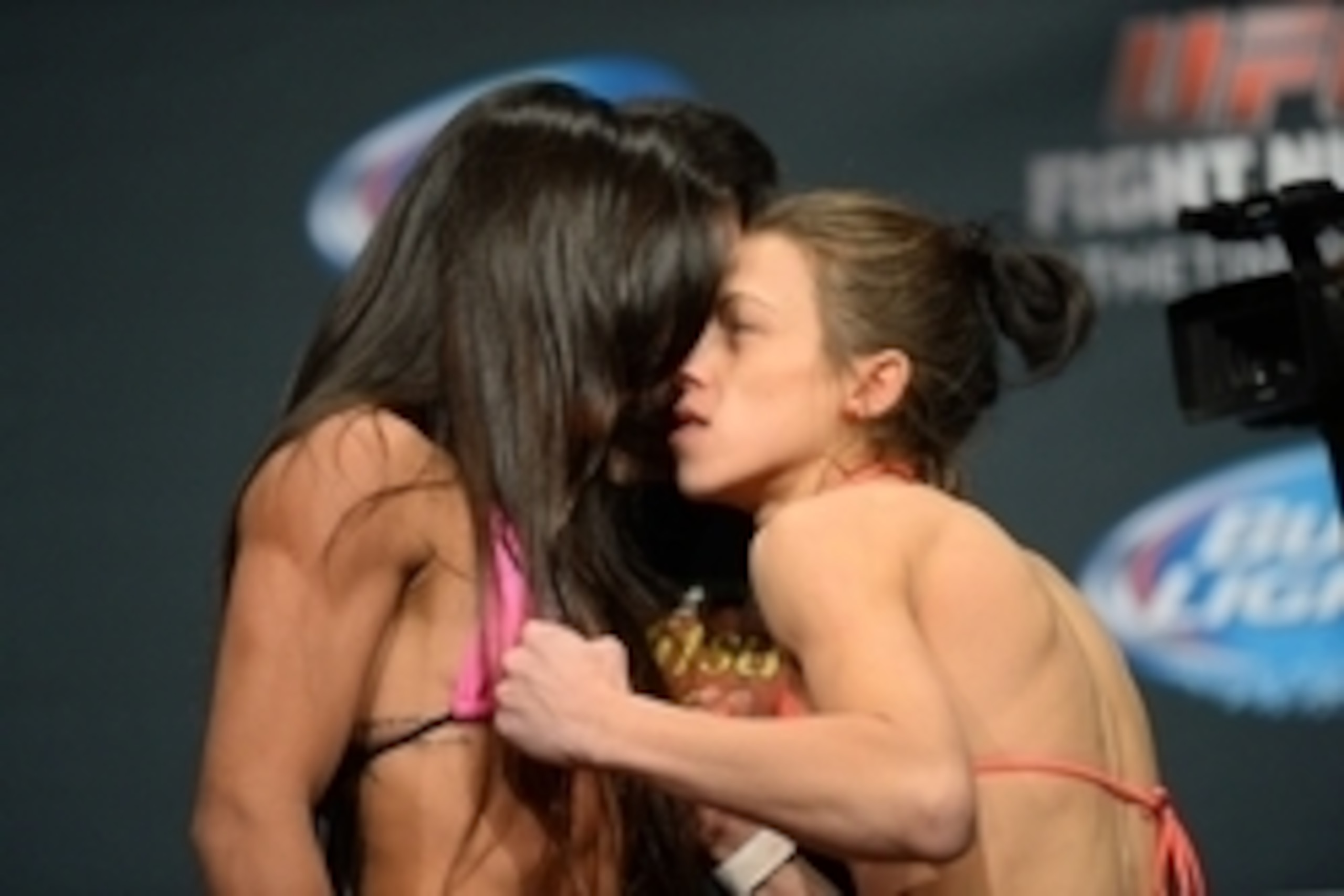 Dec 12, 2014; Phoenix, AZ, USA; Claudia Gadelha (left) and Joanna Jedrzejczyk (right) face off during weigh-ins for UFC Fight Night at Phoenix Convention Center. Mandatory Credit: Joe Camporeale-USA TODAY Sports