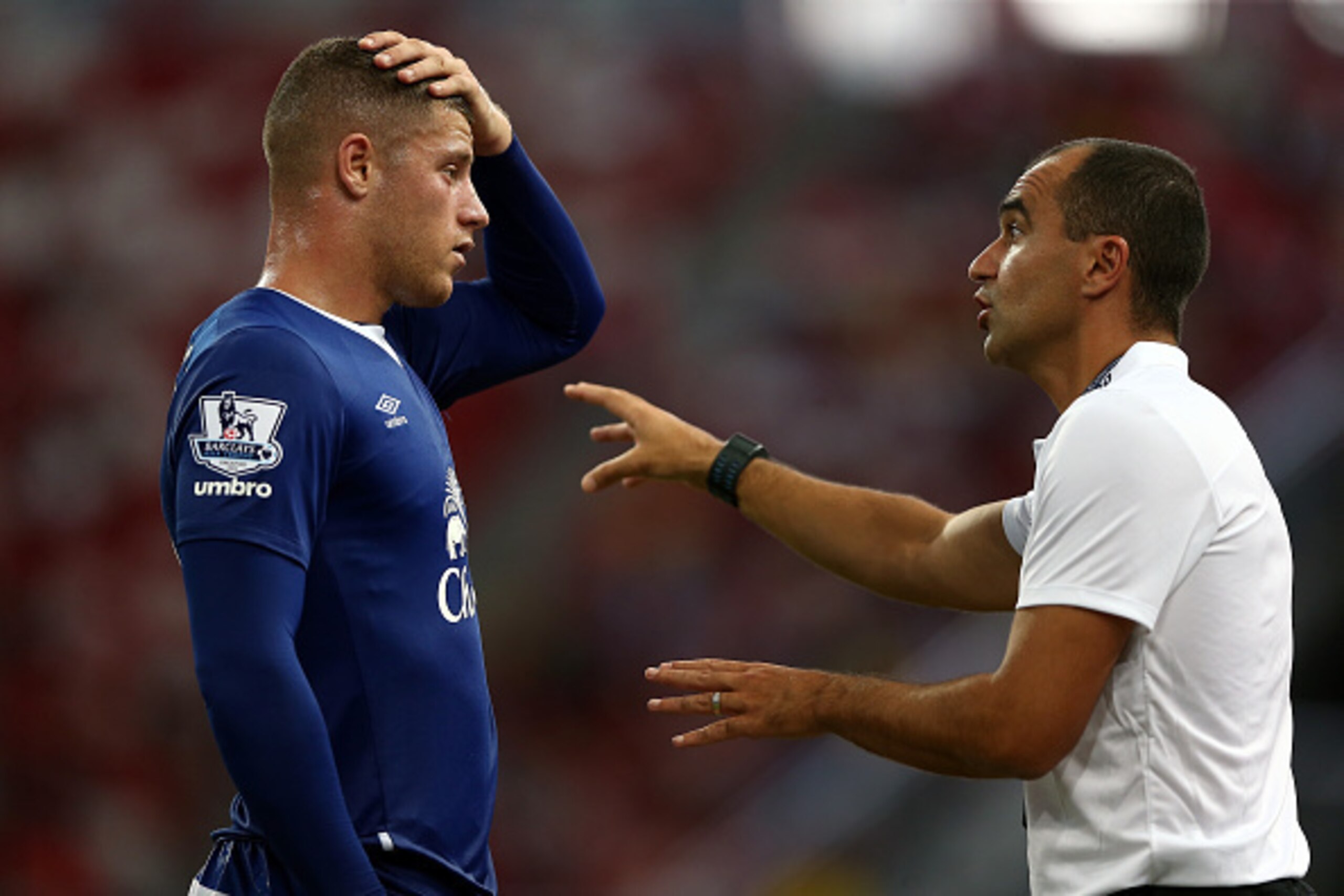 SINGAPORE - JULY 15: Roberto Martinez Manager of Everton speaks to John Stones during the Barclays Asia Trophy match between Everton and Stoke City at National Stadium on July 15, 2015 in Singapore.  (Photo by Stanley Chou/Getty Images)