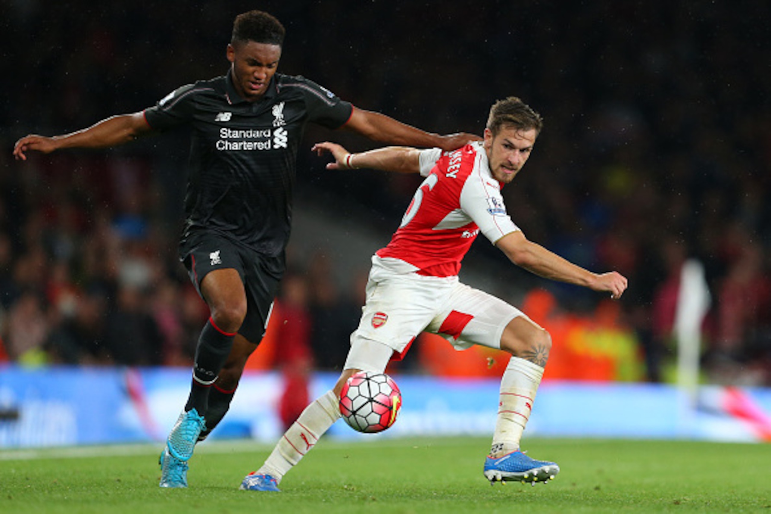 LONDON, ENGLAND - AUGUST 24:  Joe Gomez of Liverpool and Aaron Ramsey of Arsenal during the Barclays Premier League match between Arsenal and Liverpool at the Emirates Stadium on August 24, 2015 in London, United Kingdom.  (Photo by Catherine Ivill - AMA/