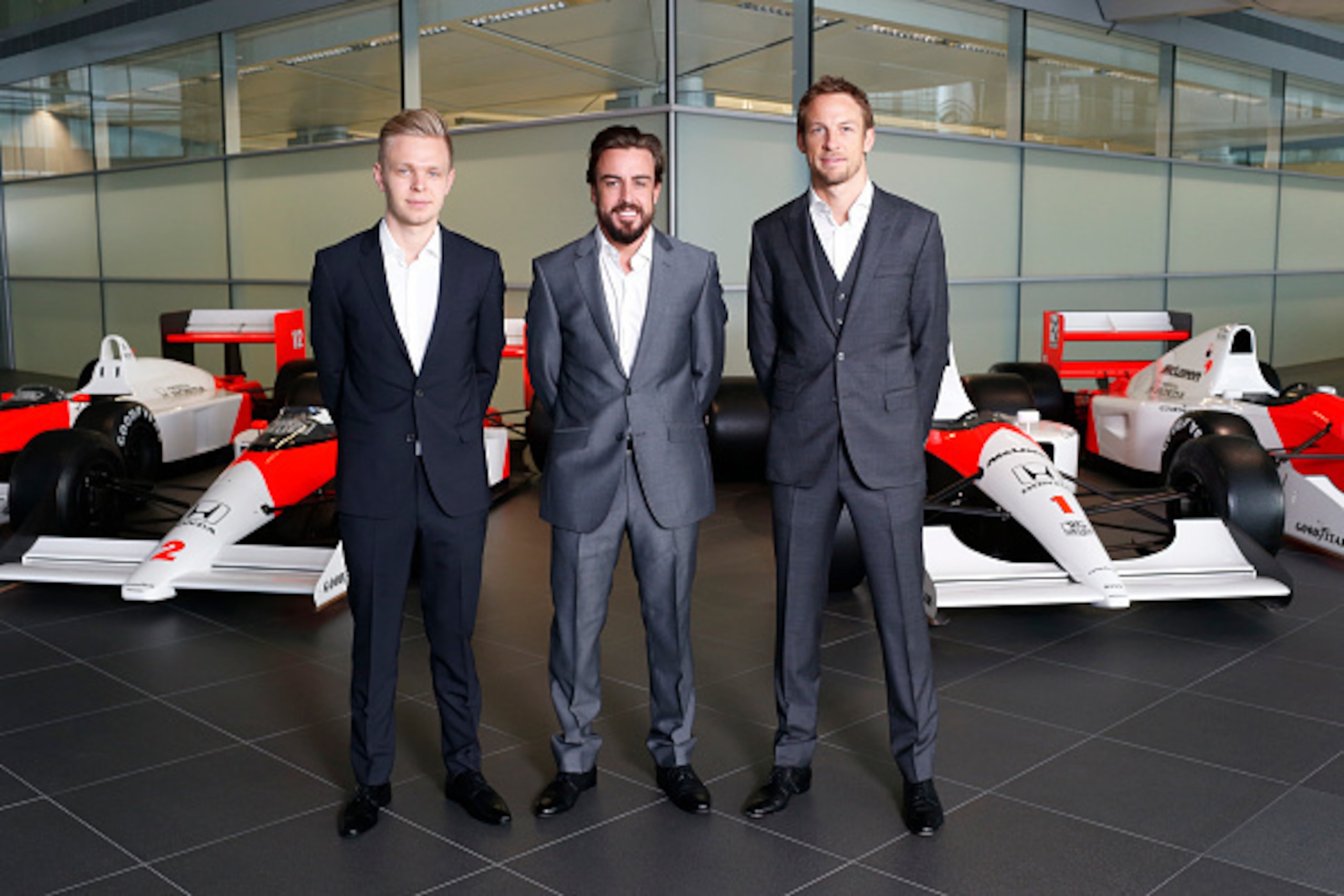WOKING, ENGLAND- DECEMBER 10: In this handout photo provided by McLaren-Honda, Formula One drivers Fernando Alonso (C) and Jenson Button (R) pose as McLaren-Honda announces its new driver line-up for 2015 with Kevin Magnussen (L) who will remain as test a