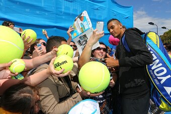 MELBOURNE, AUSTRALIA - JANUARY 26:  Nick Kyrgios of Australia poses with fans during day eight of the 2015 Australian Open at Melbourne Park on January 26, 2015 in Melbourne, Australia.  (Photo by Wayne Taylor/Getty Images)