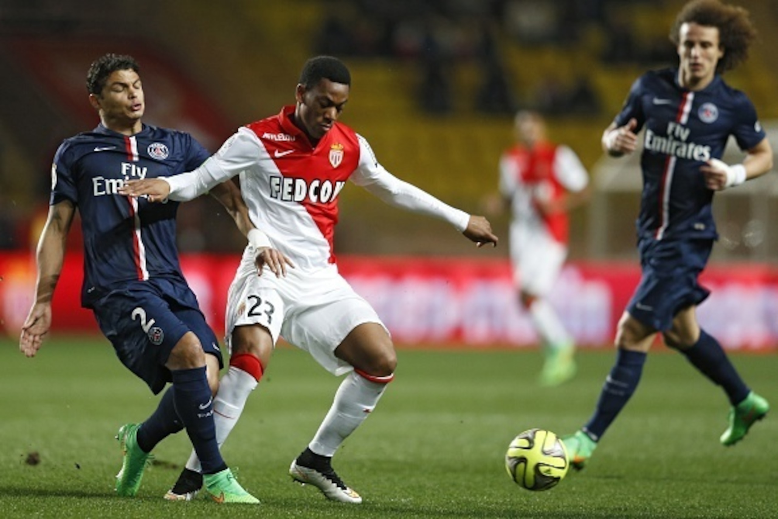 Paris Saint-Germain's Brazilian defender Thiago Silva (L) vies with Monaco's French forward Anthony Martial during the French L1 football match Monaco (ASM) vs Paris Saint-Germain (PSG), on March 1, 2015 at Louis II stadium in Monaco.  AFP PHOTO / VALERY 
