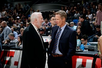 SAN ANTONIO, TX - APRIL 5: Gregg Popovich of the San Antonio Spurs and Steve Kerr of the Golden State Warriors speak before a game on April 5, 2015 at the AT&T Center in San Antonio, Texas. NOTE TO USER: User expressly acknowledges and agrees that, by dow