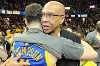 CLEVELAND, OH - JUNE 16: Klay Thompson #11 of the Golden State Warriors and father Mychal Thompson hug after the team wins the 2015 NBA Finals against the Cleveland Cavaliers in Game Six of the 2015 NBA Finals at The Quicken Loans Arena on June 16, 2015 i