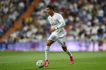 Real Madrid's Portuguese forward Cristiano Ronaldo drives the ball during the Spanish league football match Real Madrid CF vs Real Betis Balompie at the Santiago Bernabeu stadium in Madrid on August 29, 2015.   AFP PHOTO/ PIERRE-PHILIPPE MARCOU        (Ph