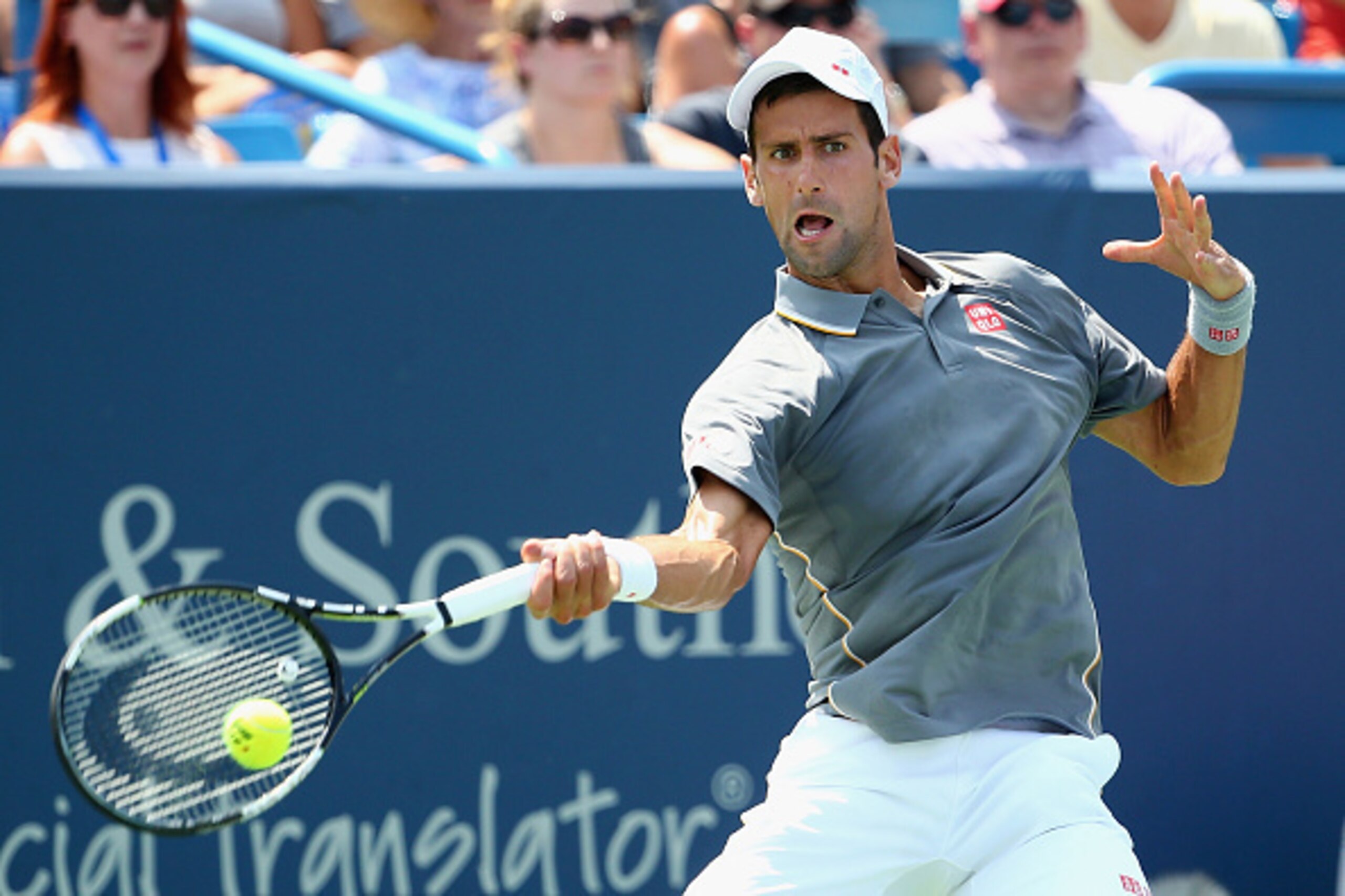 CINCINNATI, OH - AUGUST 23:  Novak Djokovic of Serbia returns a shot to Roger Federer of Switzerland during the final round on Day 9 of the Western & Southern Open at the Lindner Family Tennis Center on August 23, 2015 in Cincinnati, Ohio.  (Photo by Madd
