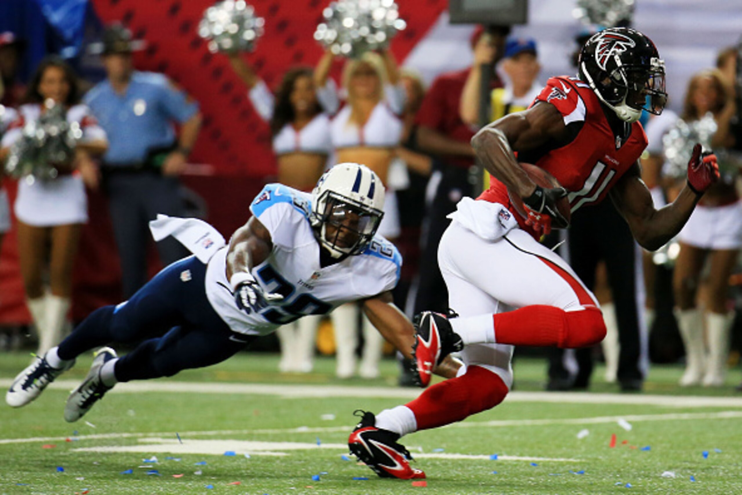 ATLANTA, GA - AUGUST 14:  Julio Jones #11 of the Atlanta Falcons runs past Perrish Cox #29 of the Tennessee Titans on route for a touchdown in the first half of a preseason game at the Georgia Dome on August 14, 2015 in Atlanta, Georgia.  (Photo by Daniel