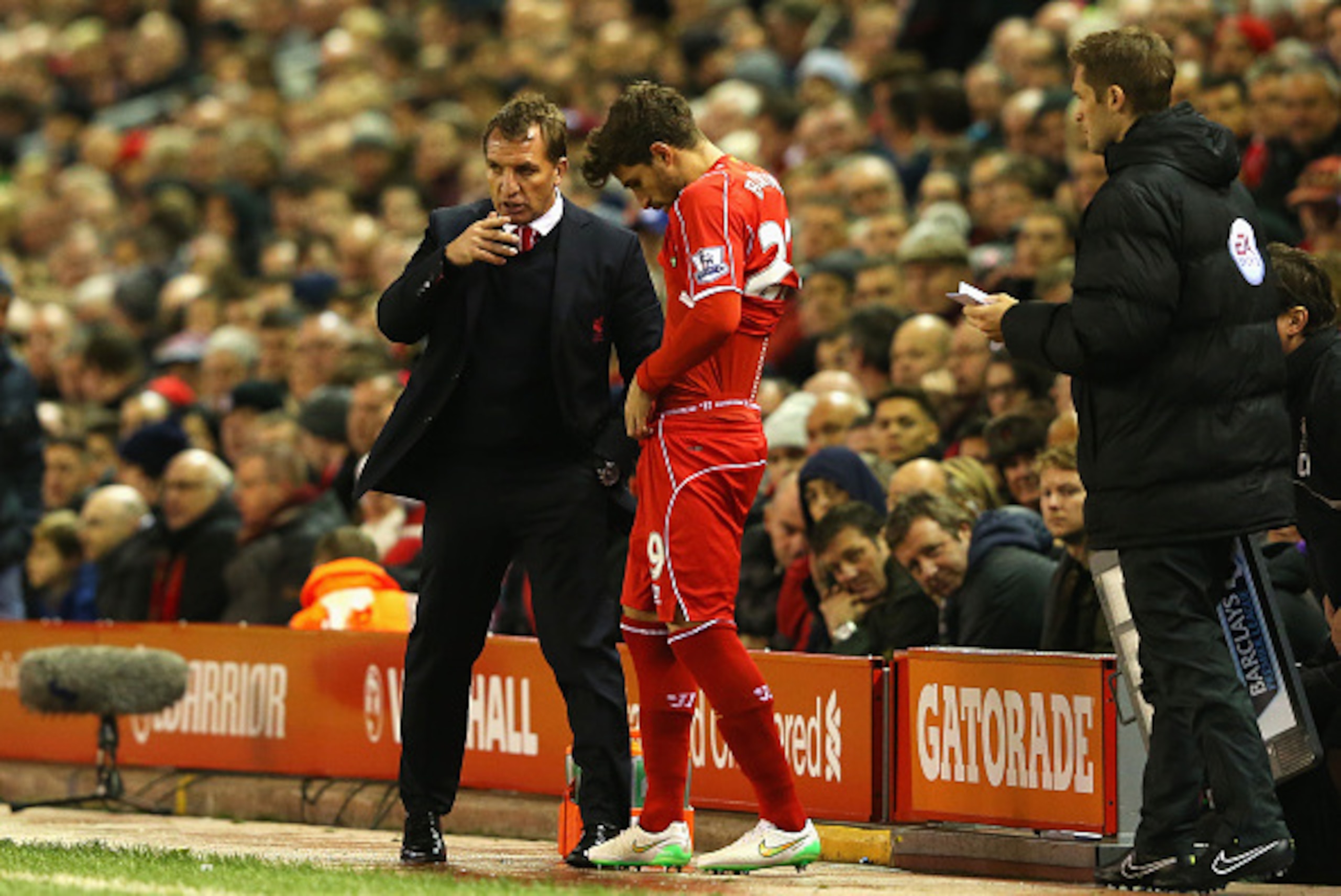 LIVERPOOL, ENGLAND - DECEMBER 21:  Brendan Rodgers, manager of Liverpool talks to Fabio Borini of Liverpool before he comes on as a substitute during the Barclays Premier League match between Liverpool and Arsenal at Anfield on December 21, 2014 in Liverp
