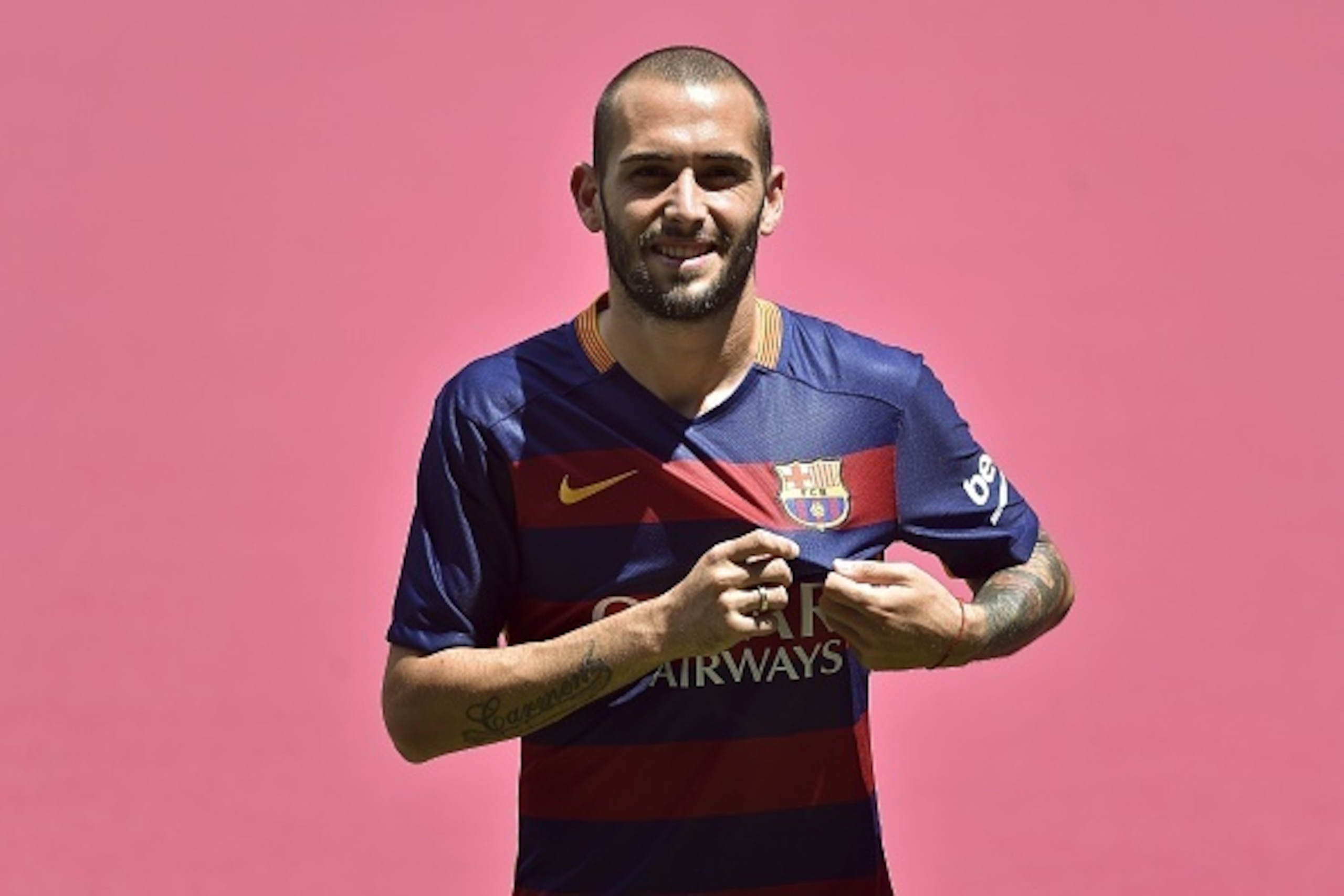 Barcelona's new Spanish defender Aleix Vidal poses with his new jersey during his official presentation at the Camp Nou stadium in Barcelona on June 8, 2015.   AFP PHOTO/ JOSEP LAGO        (Photo credit should read JOSEP LAGO/AFP/Getty Images)