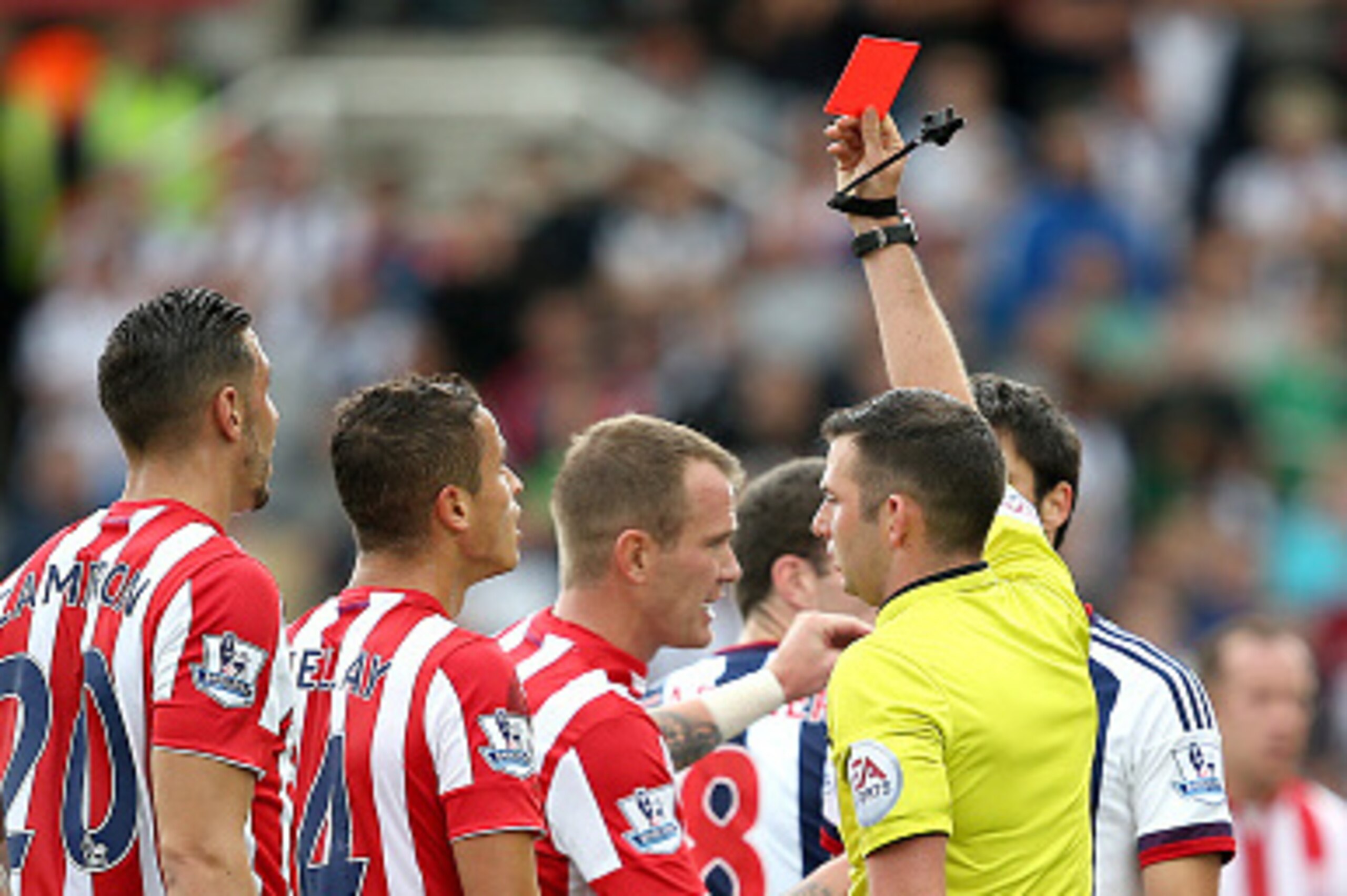 STOKE ON TRENT, ENGLAND - AUGUST 29:  Ibrahim Afellay of Stoke City is shown the red card by referee Michael Oliver during the Barclays Premier League match between Stoke City and West Bromwich Albion at Britannia Stadium on August 29, 2015 in Stoke on Tr