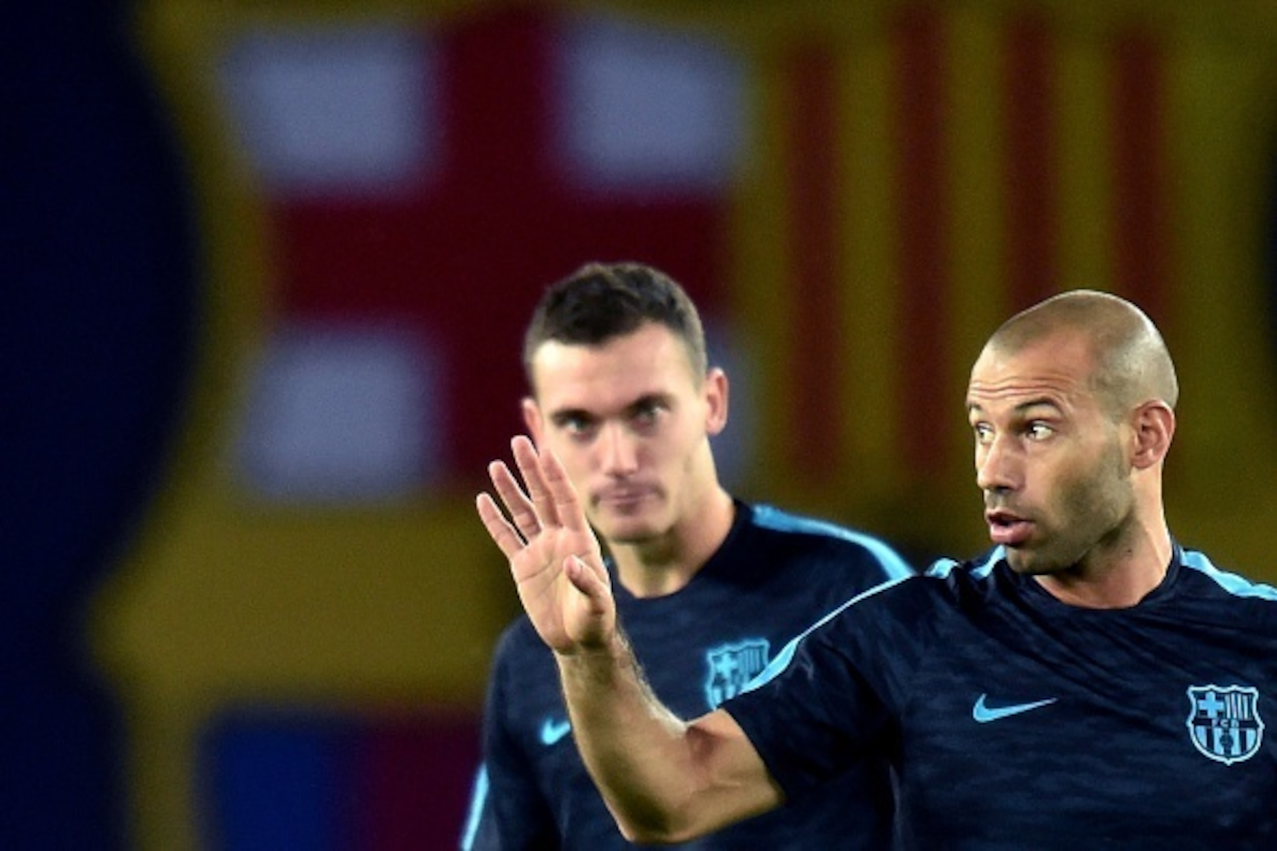 Barcelona's Argentinian defender Javier Mascherano (R) and Barcelona's Belgian defender Thomas Vermaelen attend a training session at the Boris Paichadze Dinamo Arena in Tbilisi on August 10, 2015, on the eve of the UEFA Super Cup football match between F