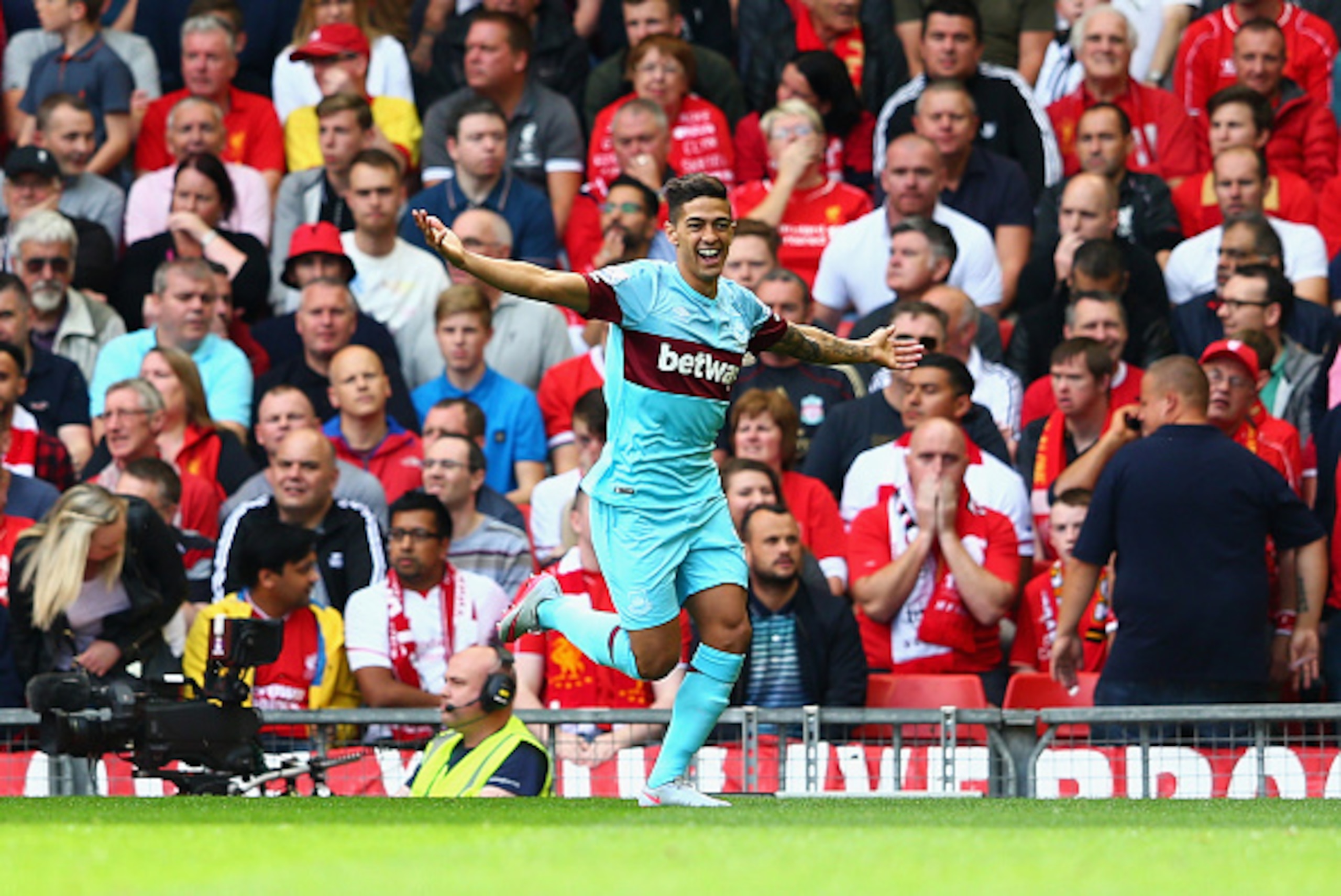 LIVERPOOL, ENGLAND - AUGUST 29: Manuel Lanzini of West Ham United celebrates scoring his team's first goal during the Barclays Premier League match between Liverpool and West Ham United at Anfield on August 29, 2015 in Liverpool, England.  (Photo by Clive