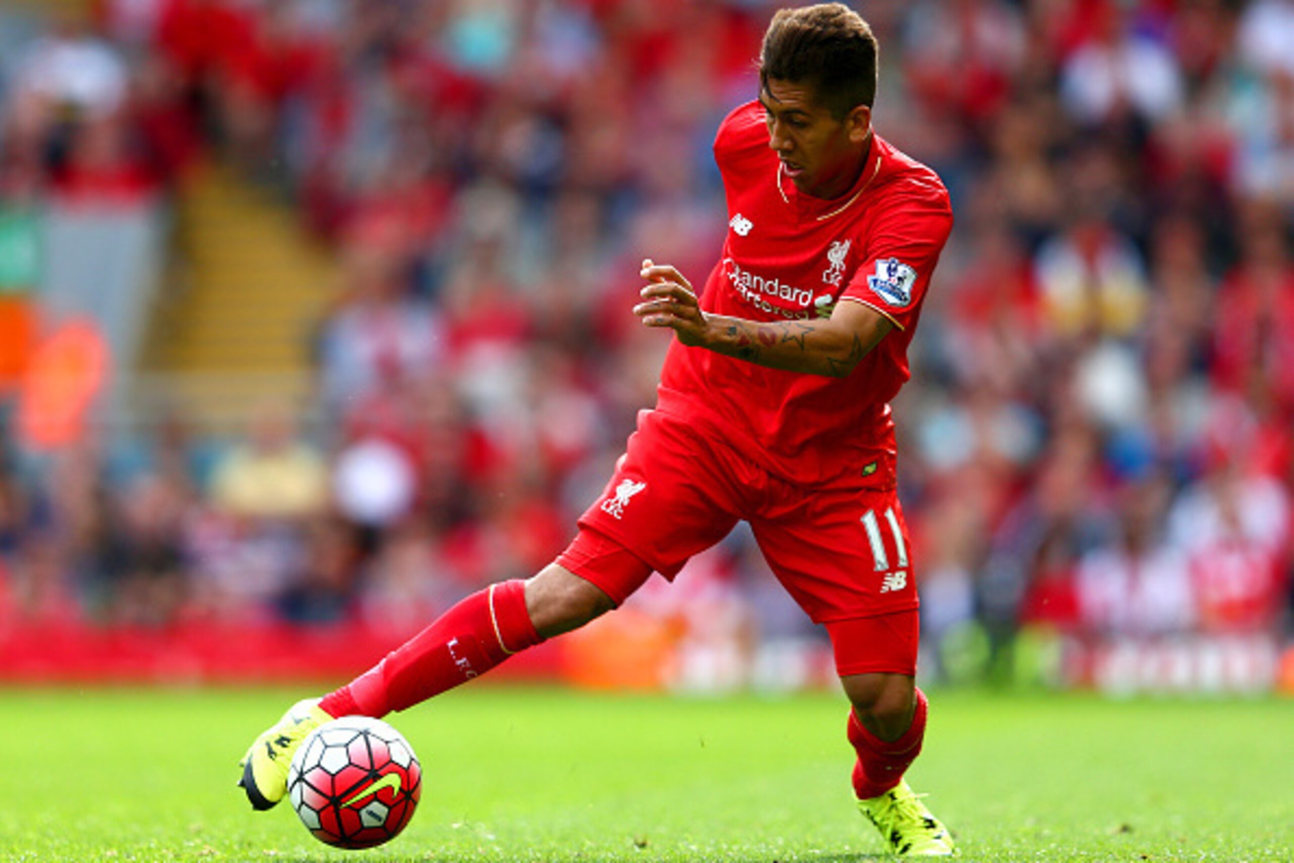 LIVERPOOL, ENGLAND - AUGUST 29: Roberto Firmino of Liverpool in action during the Barclays Premier League match between Liverpool and West Ham United at Anfield on August 29, 2015 in Liverpool, England.  (Photo by Clive Mason/Getty Images)