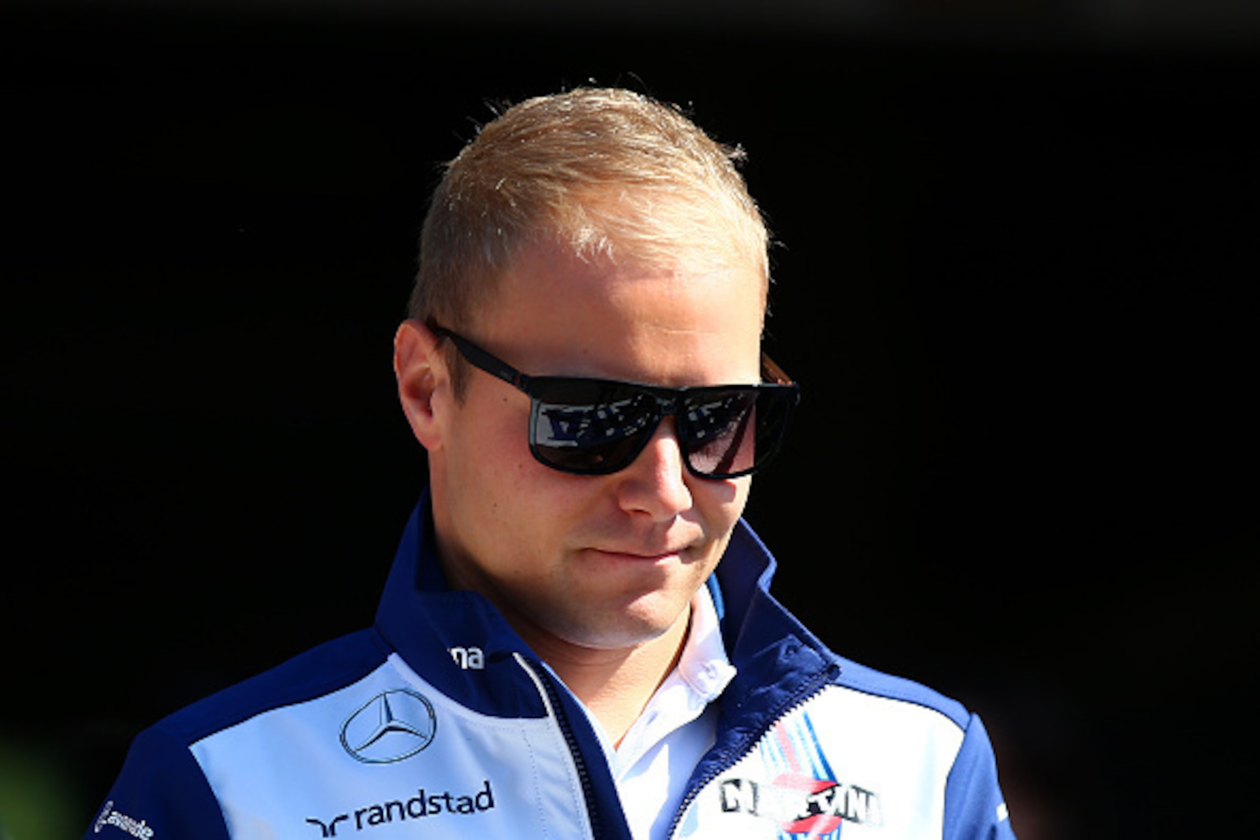 SPA, BELGIUM - AUGUST 23:  Valtteri Bottas of Finland and Williams arrives forthe drivers' parade before the Formula One Grand Prix of Belgium at Circuit de Spa-Francorchamps on August 23, 2015 in Spa, Belgium.  (Photo by Mark Thompson/Getty Images)