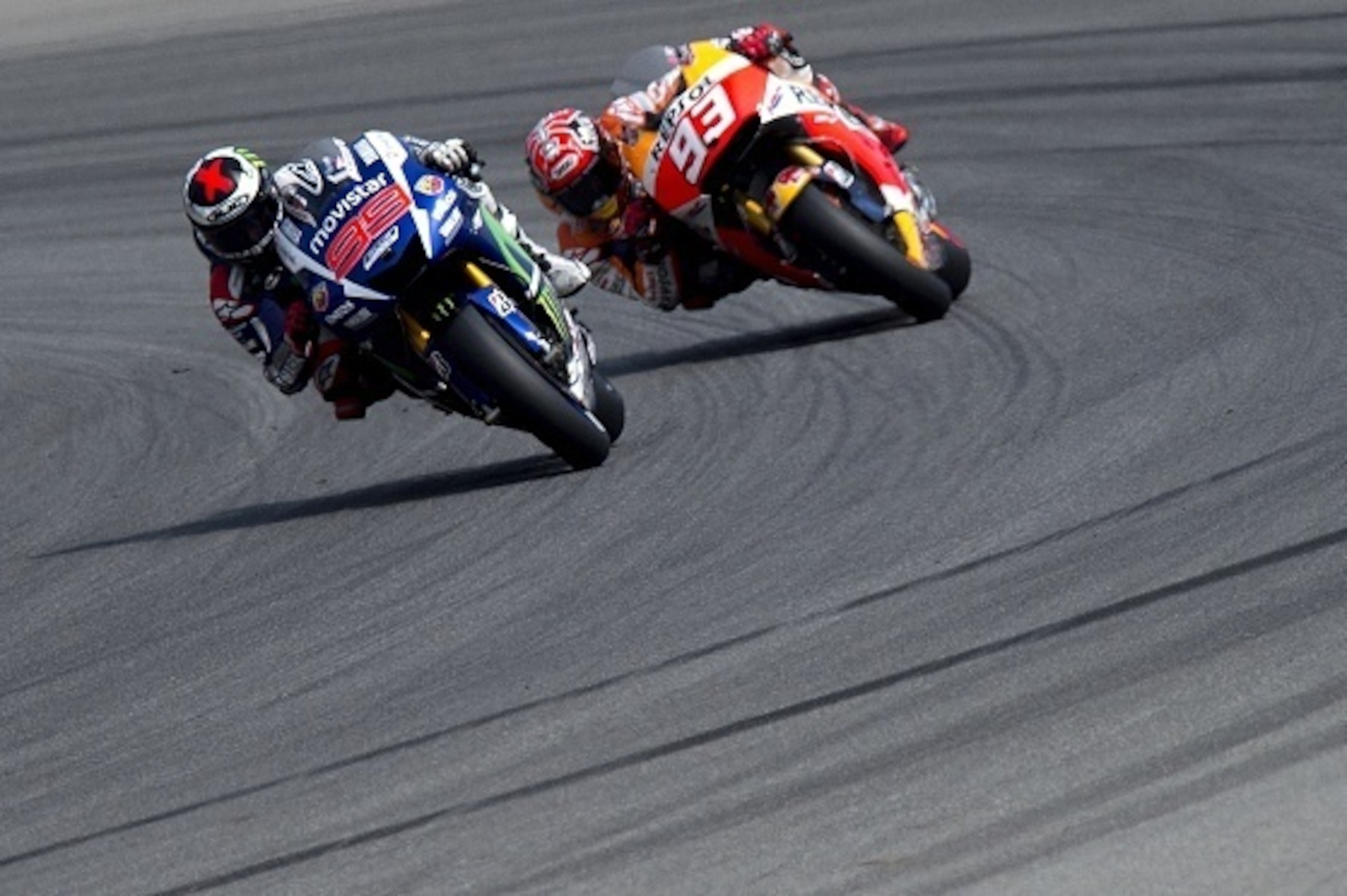 Yamaha MotoGP's Spanish rider Jorge Lorenzo (L) and Repsol Honda Team's Spanish rider Marc Marquez compete during the Moto GP Czech Grand Prix in Brno, Czech Republic, on August 16, 2015. Yamaha MotoGP's Spanish rider Jorge Lorenzo won the race ahead of R