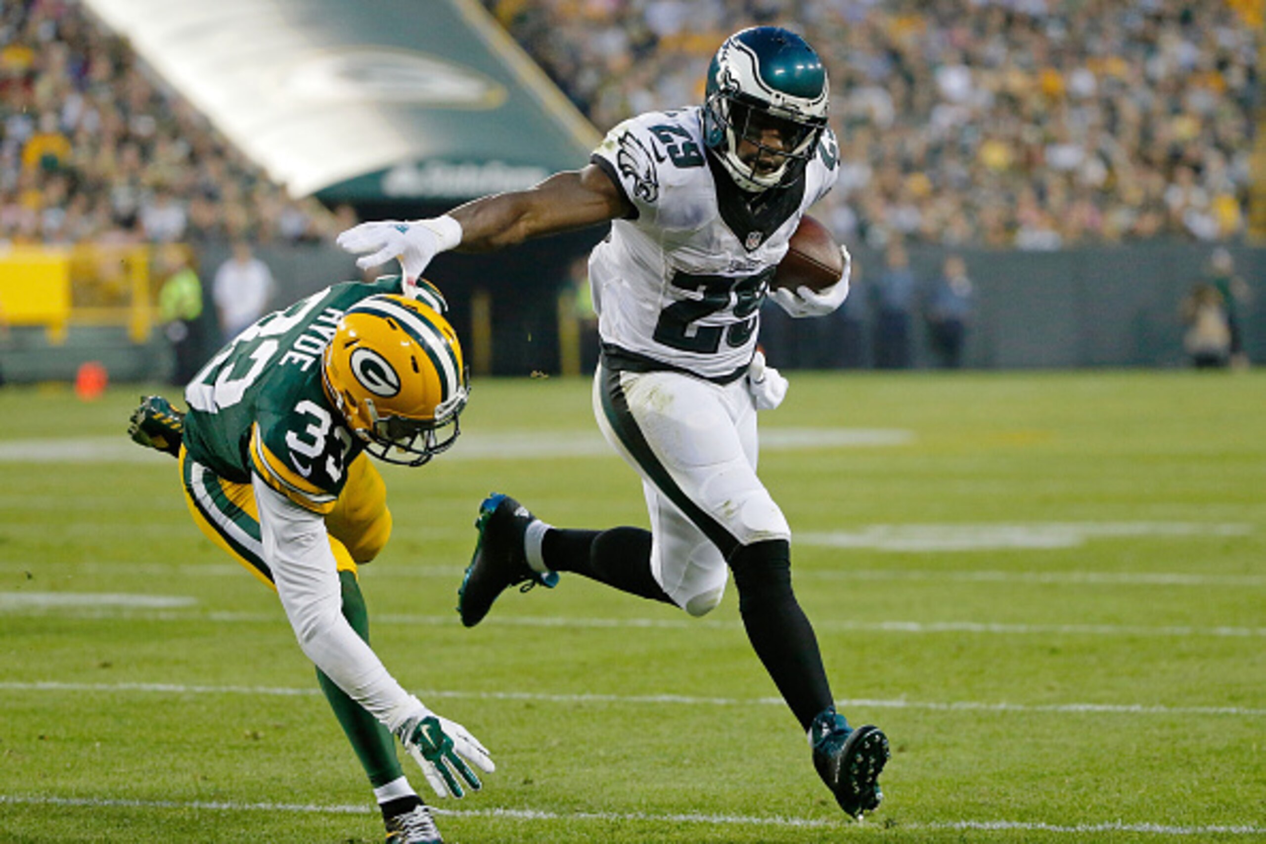 GREEN BAY, WI - AUGUST 29: DeMarco Murray #29 of the Philadelphia Eagles stiff arms Micah Hyde #33 of the Green Bay Packers during the first quarter of a preseason game at Lambeau Field on August 29, 2015 in Green Bay, Wisconsin.  (Photo by Jon Durr/Getty