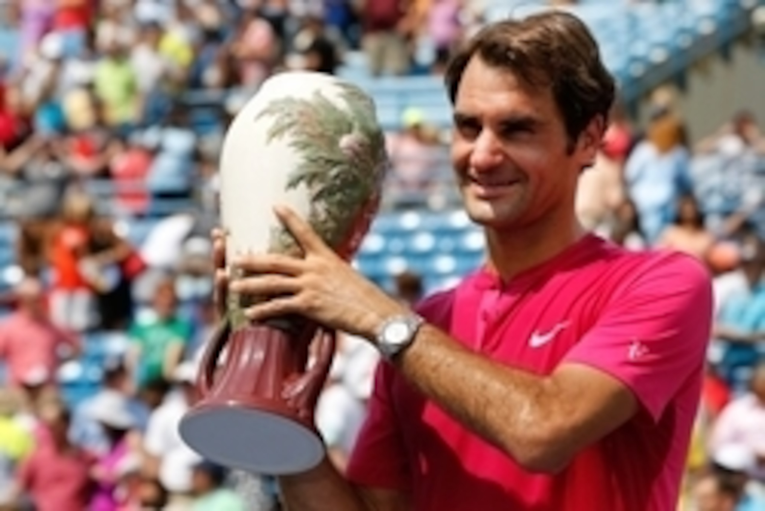 Aug 23, 2015; Cincinnati, OH, USA; Roger Federer (SUI) holds the Rookwood Cup after the finals during the Western and Southern Open tennis tournament at the Linder Family Tennis Center. Mandatory Credit: Aaron Doster-USA TODAY Sports