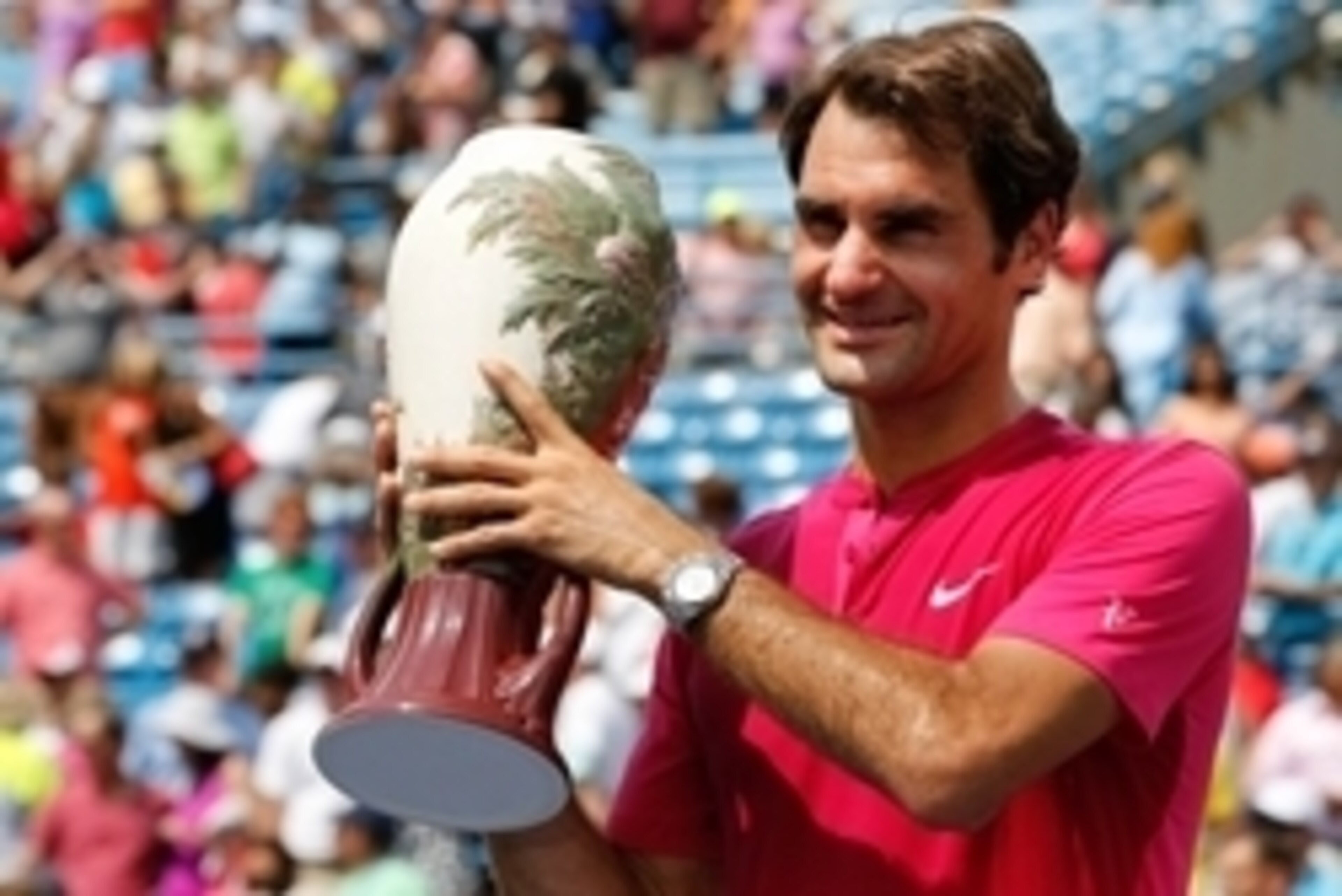 Aug 23, 2015; Cincinnati, OH, USA; Roger Federer (SUI) holds the Rookwood Cup after the finals during the Western and Southern Open tennis tournament at the Linder Family Tennis Center. Mandatory Credit: Aaron Doster-USA TODAY Sports
