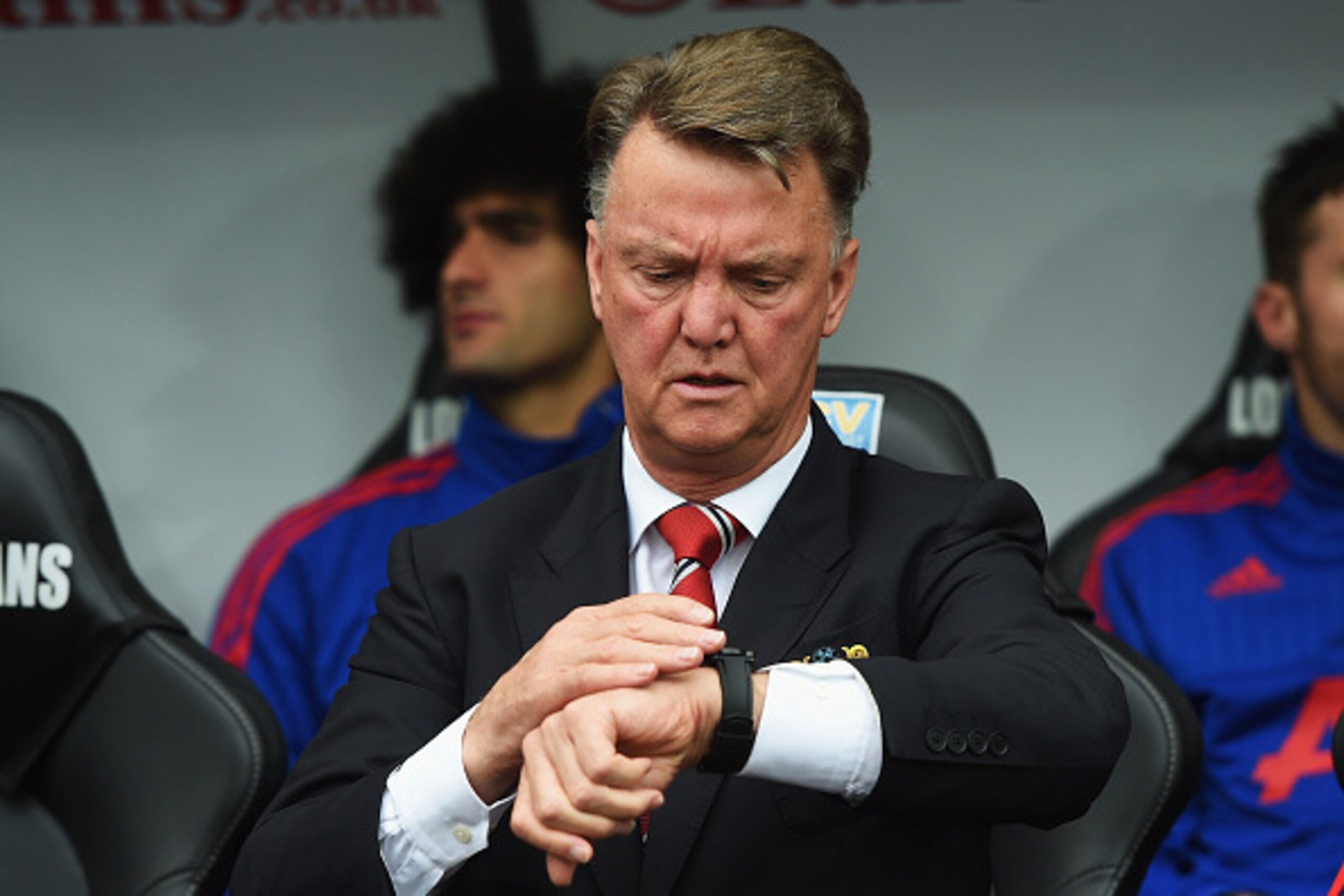 SWANSEA, WALES - AUGUST 30:  Louis van Gaal, manager of Manchester United looks at his watch during the Barclays Premier League match between Swansea City and Manchester United at Liberty Stadium on August 30, 2015 in Swansea, Wales.  (Photo by Michael Re
