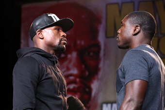 LOS ANGELES, CA - AUGUST 06:  Floyd Mayweather (L) and Andre Berto face off at a press conference ahead of the upcoming fight at JW Marriott Los Angeles at L.A. LIVE on August 6, 2015 in Los Angeles, California.  (Photo by Stephen Dunn/Getty Images)
