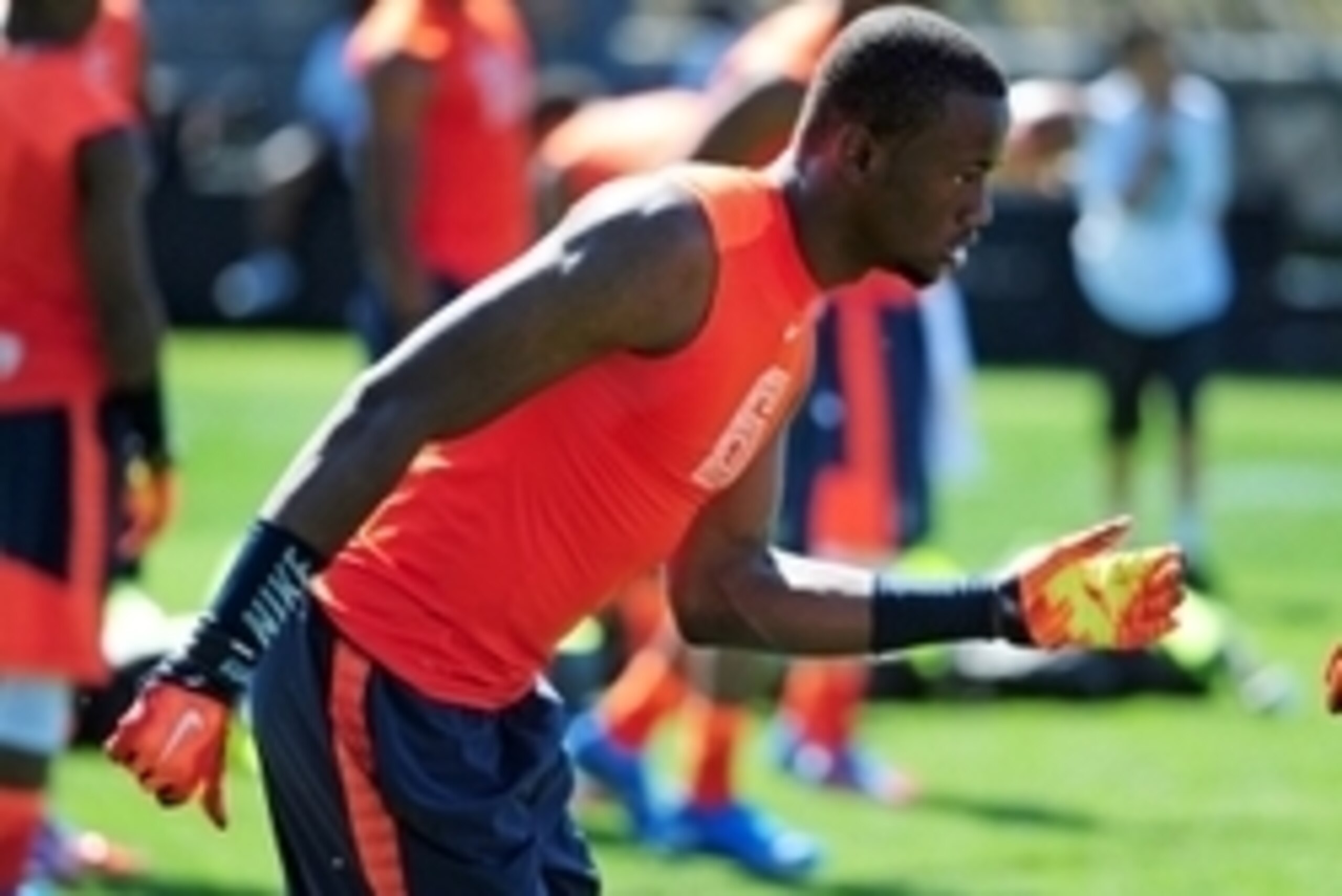 Jul 9, 2014; Beaverton, OR, USA; Alpha Pro athlete Torrance Gibson (6) heads off the line of scrimmage during Nike Football ' The Opening' at Nike World Headquarters. Mandatory Credit: Steve Dykes-USA TODAY Sports