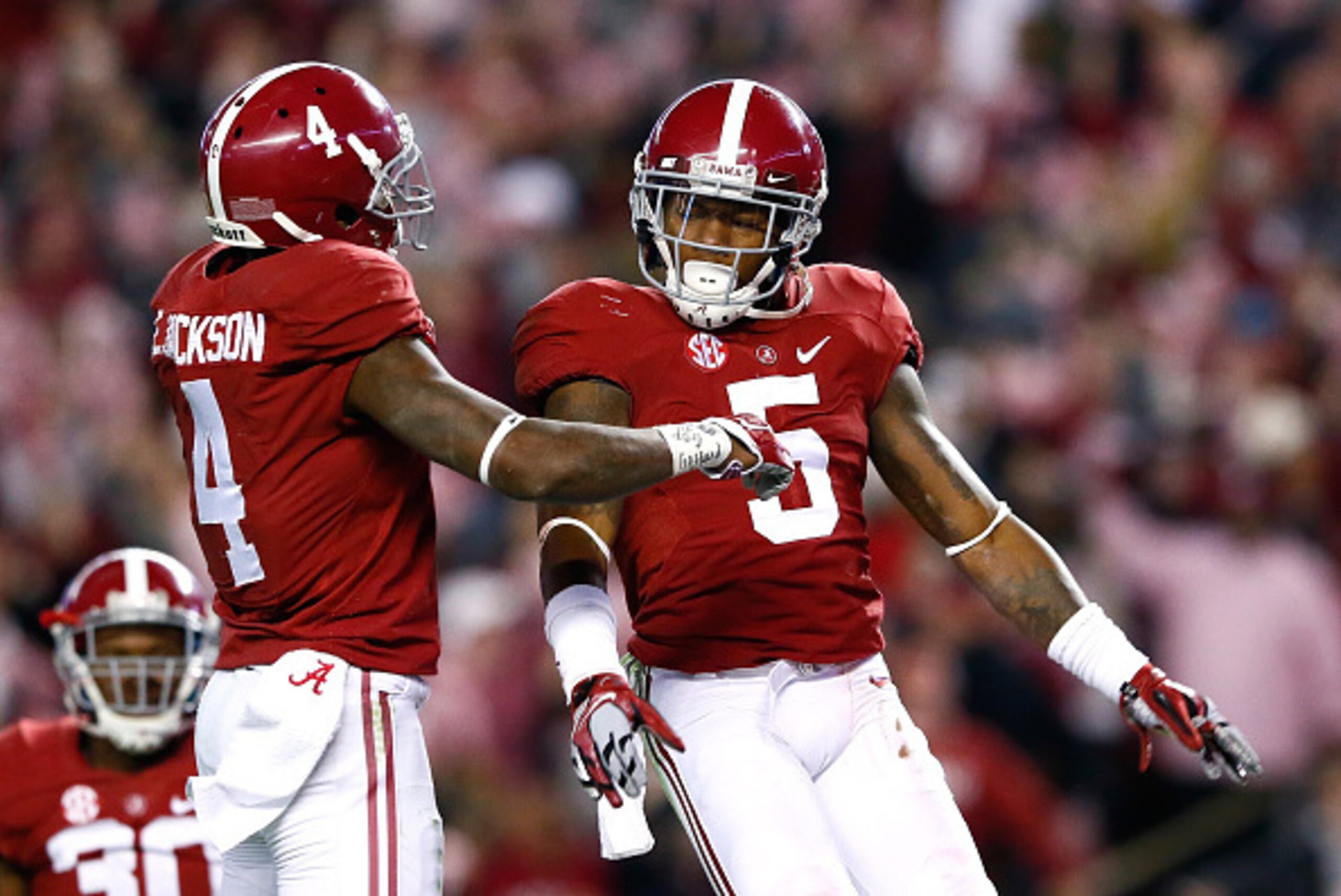 TUSCALOOSA, AL - NOVEMBER 15:  Cyrus Jones #5 of the Alabama Crimson Tide reacts after intercepting a touchdown reception intended for De'Runnya Wilson #1 of the Mississippi State Bulldogs with Eddie Jackson #4 at Bryant-Denny Stadium on November 15, 2014