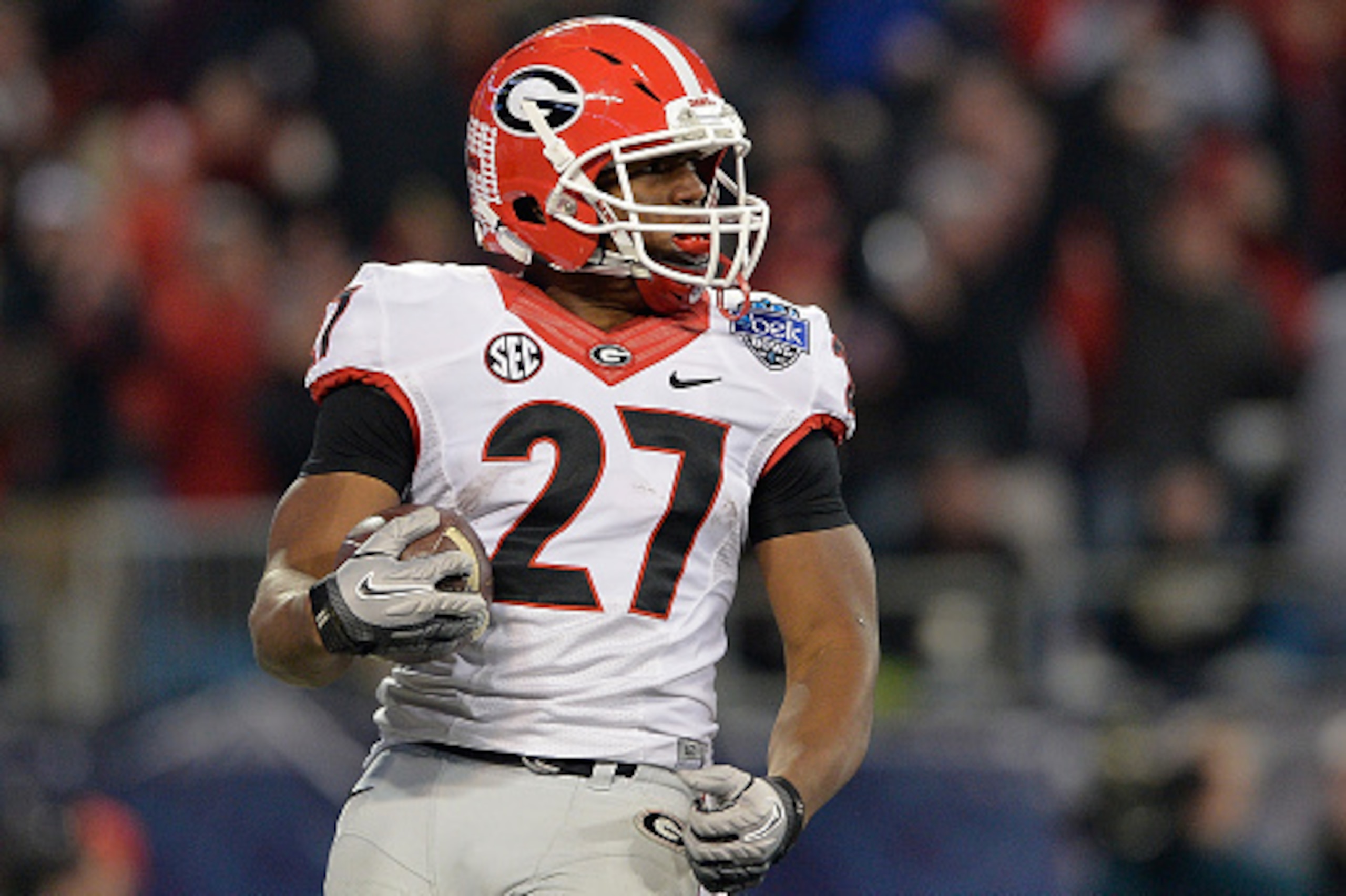 CHARLOTTE, NC - DECEMBER 30:  Nick Chubb #27 of the Georgia Bulldogs runs against the Louisville Cardinals during the Belk Bowl at Bank of America Stadium on December 30, 2014 in Charlotte, North Carolina. Georgia won 37-14.  (Photo by Grant Halverson/Get