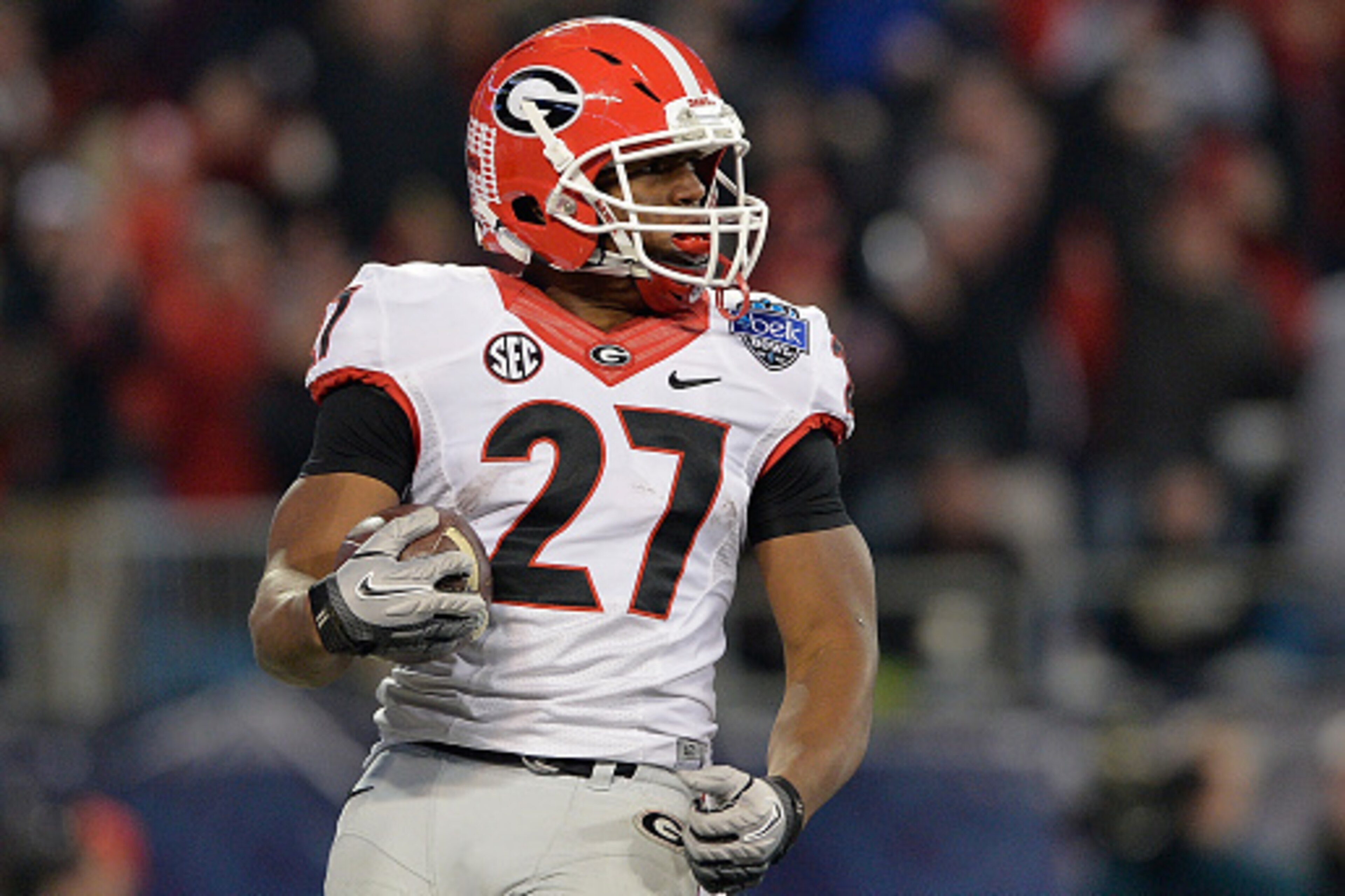 CHARLOTTE, NC - DECEMBER 30:  Nick Chubb #27 of the Georgia Bulldogs runs against the Louisville Cardinals during the Belk Bowl at Bank of America Stadium on December 30, 2014 in Charlotte, North Carolina. Georgia won 37-14.  (Photo by Grant Halverson/Get