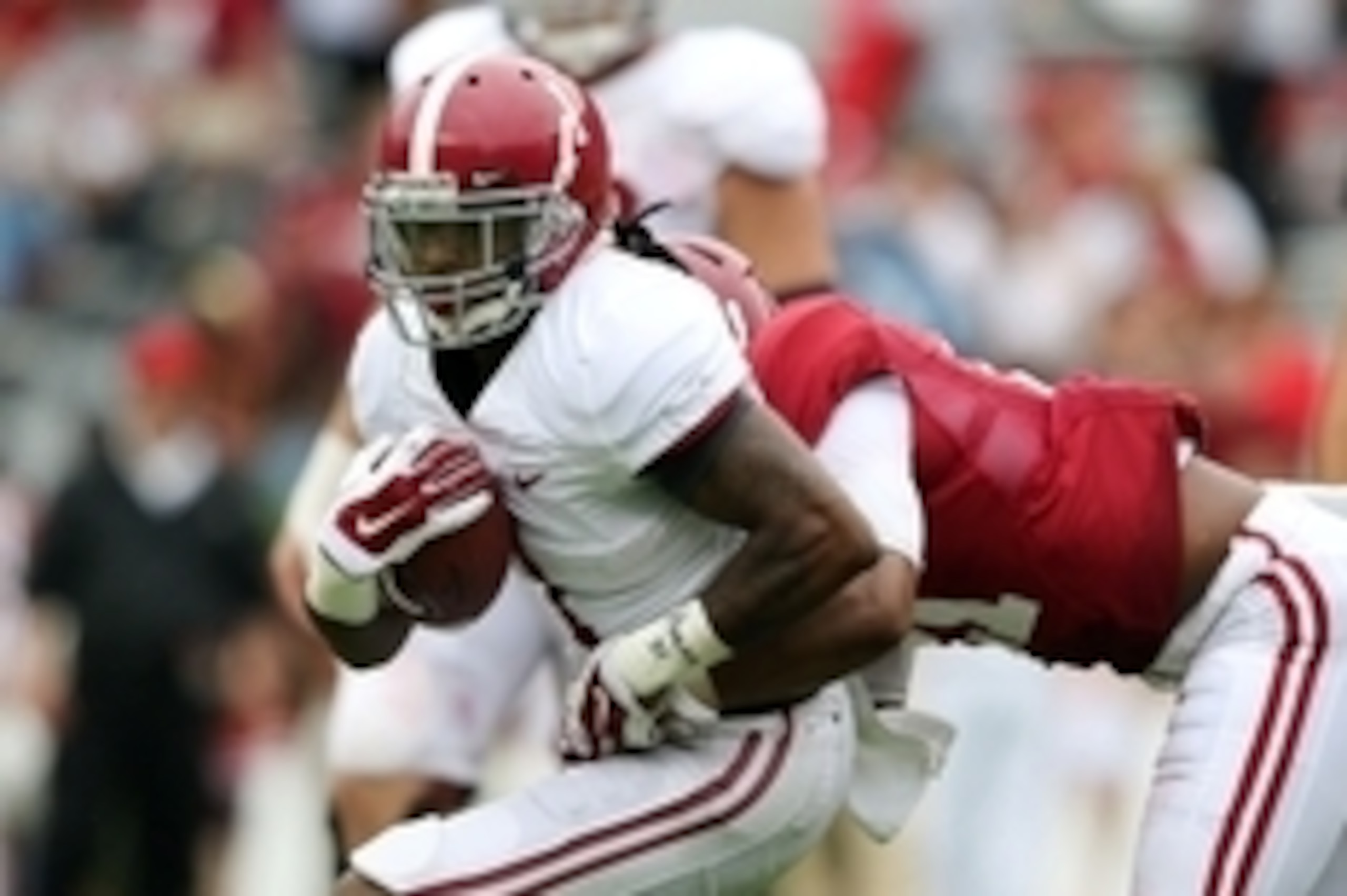 Apr 18, 2015; Tuscaloosa, AL, USA; Alabama Crimson Tide wide receiver Chris Black (1) carries the ball for the white team as Alabama Crimson Tide defensive back Maurice Smith (21) of the crimson team grabs him during the annual A-day game at Bryant Denny 