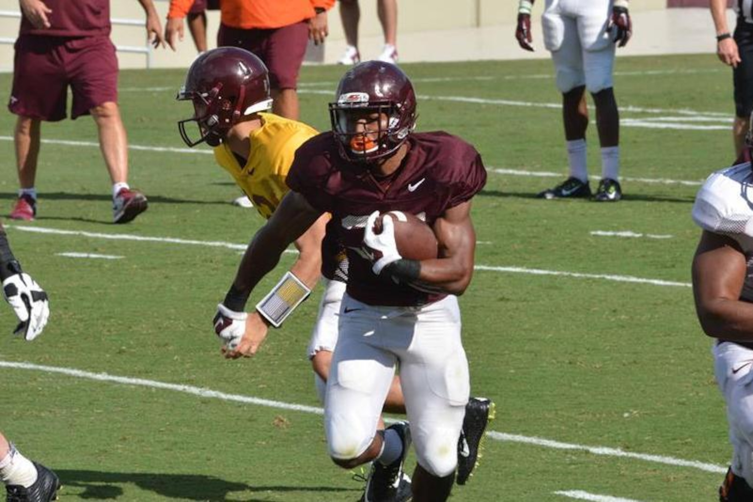 Travon McMillian rips off a big run in a scrimmage during fall camp