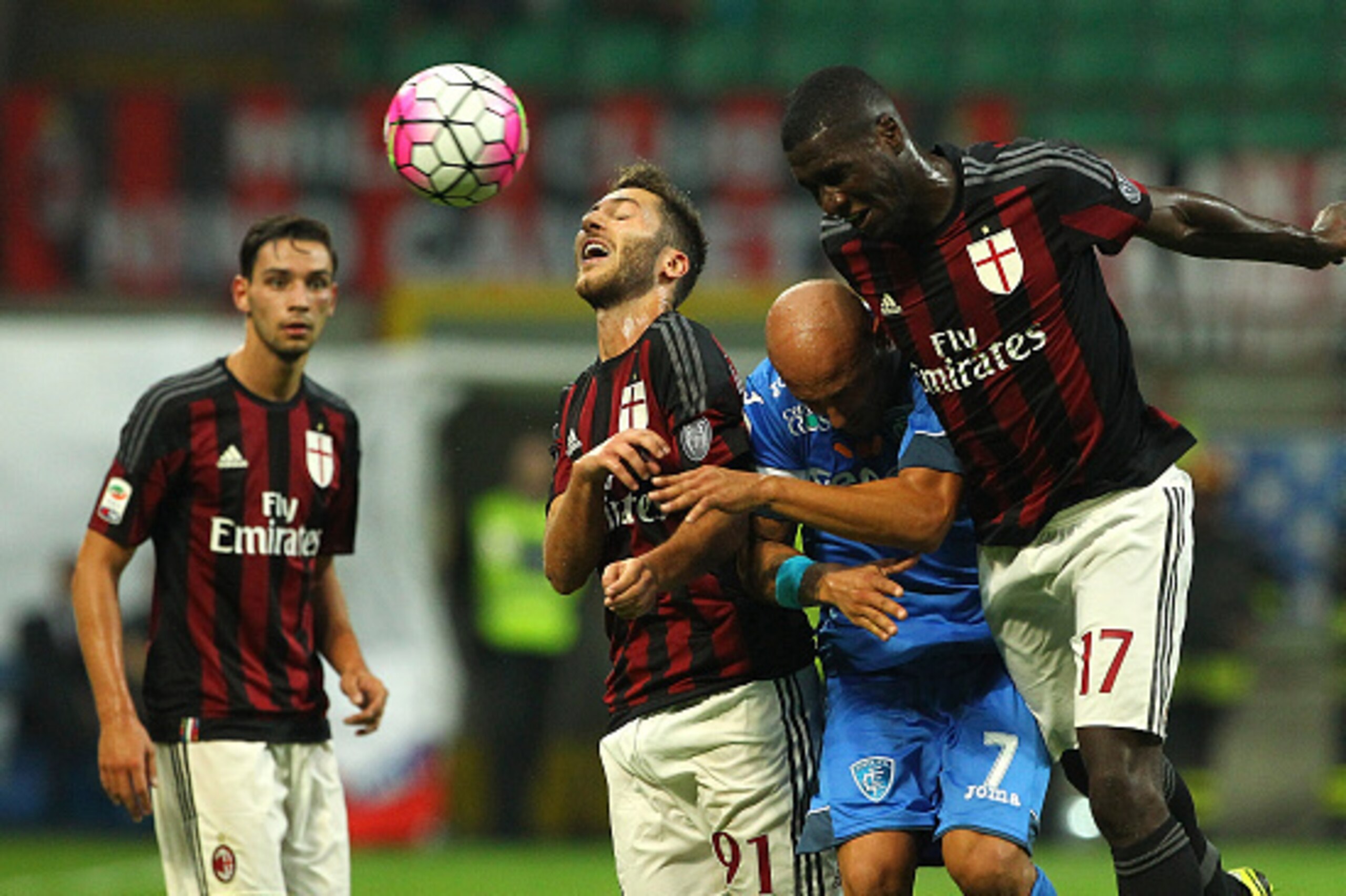 MILAN, ITALY - AUGUST 29:  Massimo Maccarone (C) of Empoli FC competes for the ball with Andrea Bertolacci (L) and Cristian Zapata (R) of AC Milan during the Serie A match between AC Milan and Empoli FC at Stadio Giuseppe Meazza on August 29, 2015 in Mila