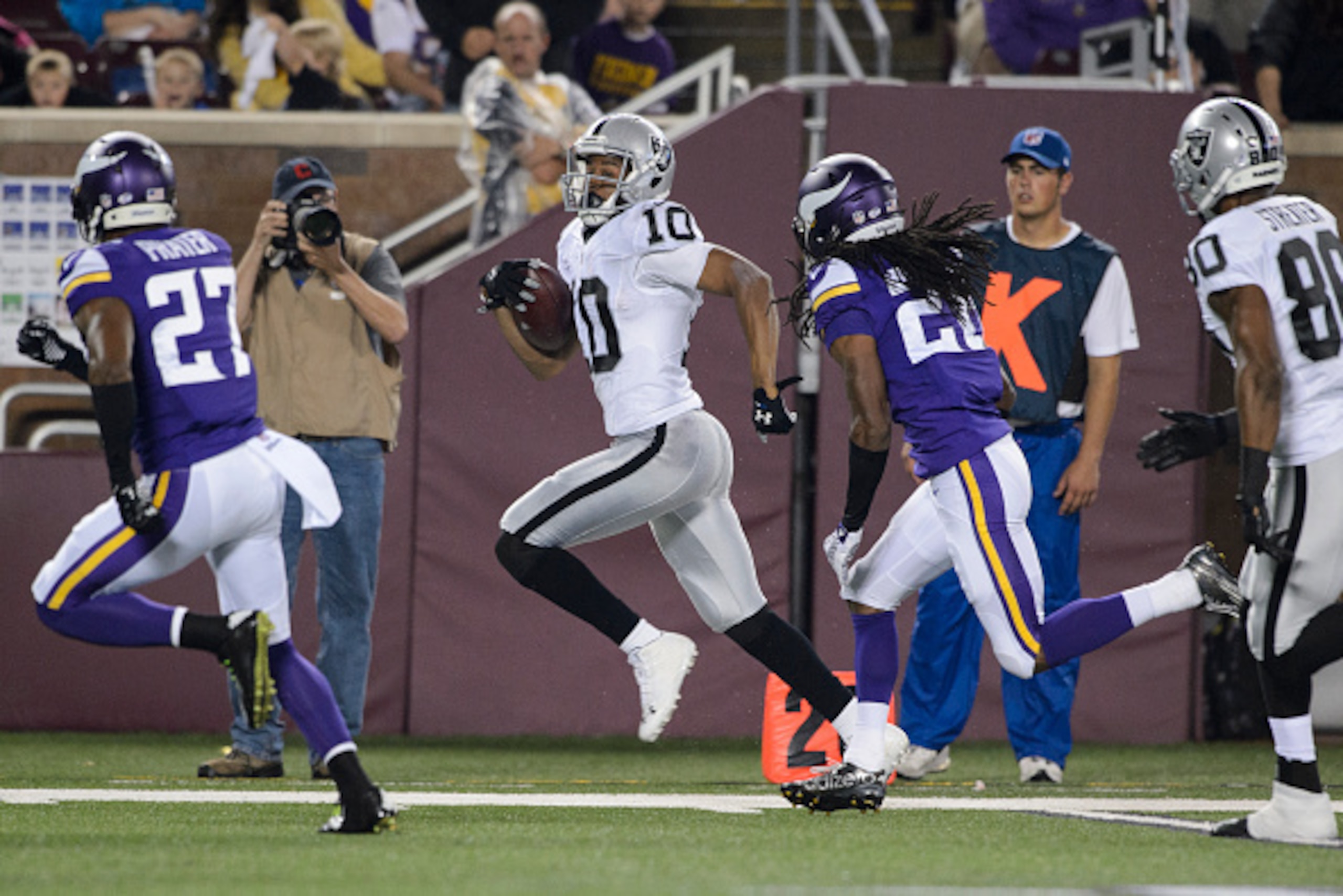 MINNEAPOLIS, MN - AUGUST 22: Seth Roberts #10 of the Oakland Raiders carries the ball against Shaun Prater #27 and Trae Waynes #26 of the Minnesota Vikings during the preseason game on August 22, 2014 at TCF Bank Stadium in Minneapolis, Minnesota. The Vik MINNEAPOLIS, MN - AUGUST 22: Seth Roberts #10 of the Oakland Raiders carries the ball against Shaun Prater #27 and Trae Waynes #26 of the Minnesota Vikings during the preseason game on August 22, 2014 at TCF Bank Stadium in Minneapolis, Minnesota. The Vik