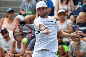 Mardy Fish of the US returns a shot to Italy's Marco Cecchinato during their 2015 US Open Mens Singles round 1 match at USTA Billie Jean King National Tennis Center in New York on August 31, 2015. AFP PHOTO/JEWEL SAMAD        (Photo credit should read JEW