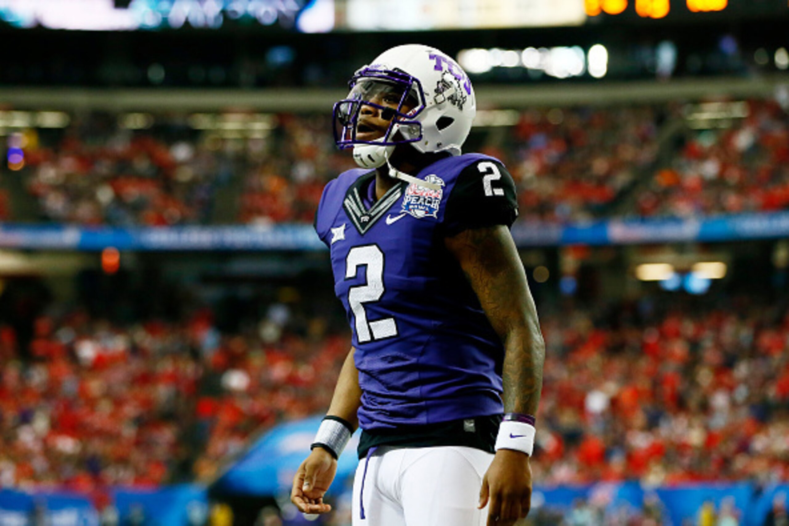 ATLANTA, GA - DECEMBER 31:  Trevone Boykin #2 of the TCU Horned Frogs celebrates a touchdown by Aaron Green #22 in the first quarter against the Ole Miss Rebels during the Chik-fil-A Peach Bowl at Georgia Dome on December 31, 2014 in Atlanta, Georgia.  (P