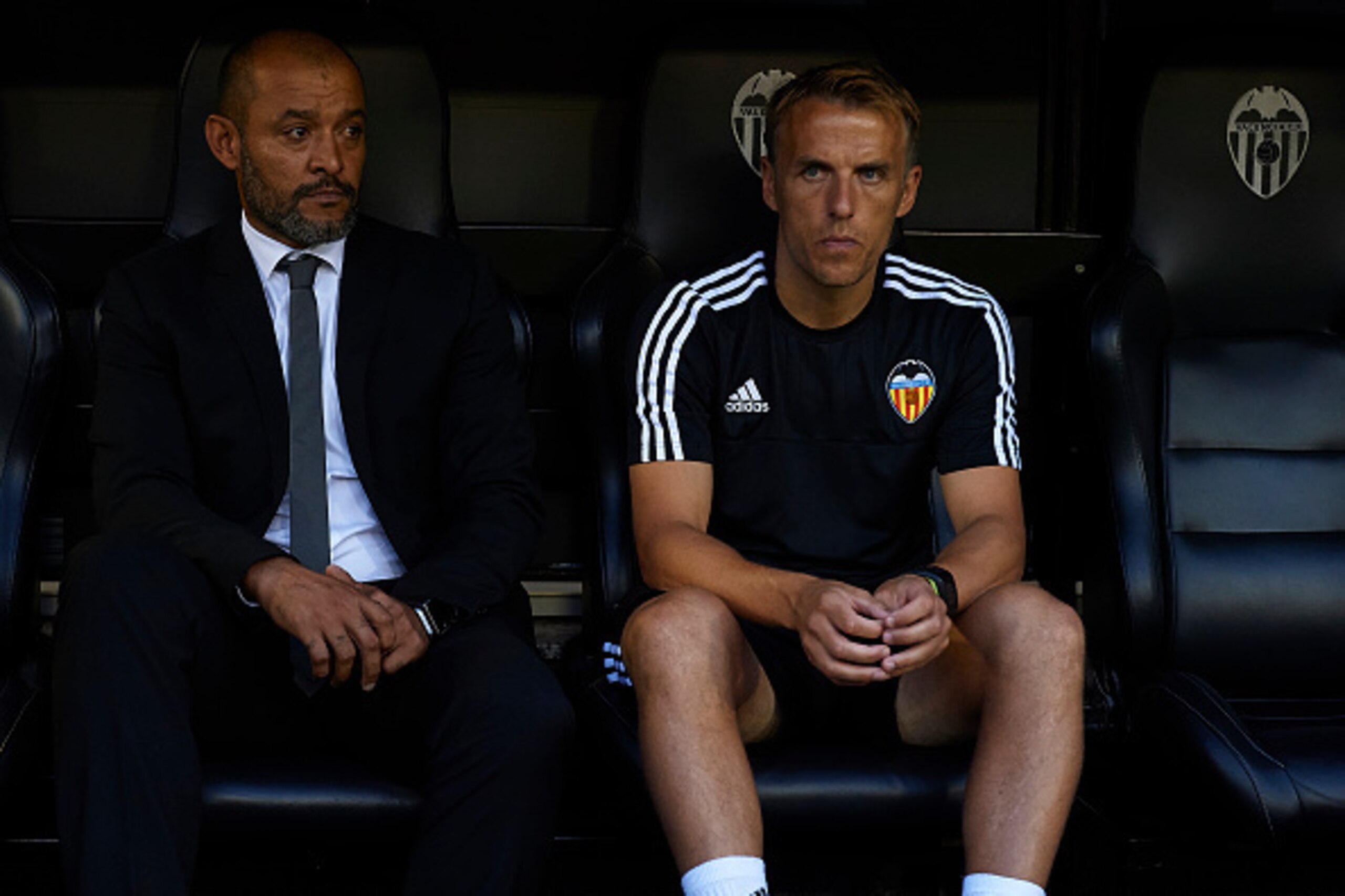 VALENCIA, SPAIN - AUGUST 19:  Valencia manager Nuno Espirito Santo (L) and his assistant coach Phil Neville prior to the UEFA Champions League Qualifying Round Play Off First Leg match between Valencia CF and AS Monaco at Mestalla Stadium on August 19, 20