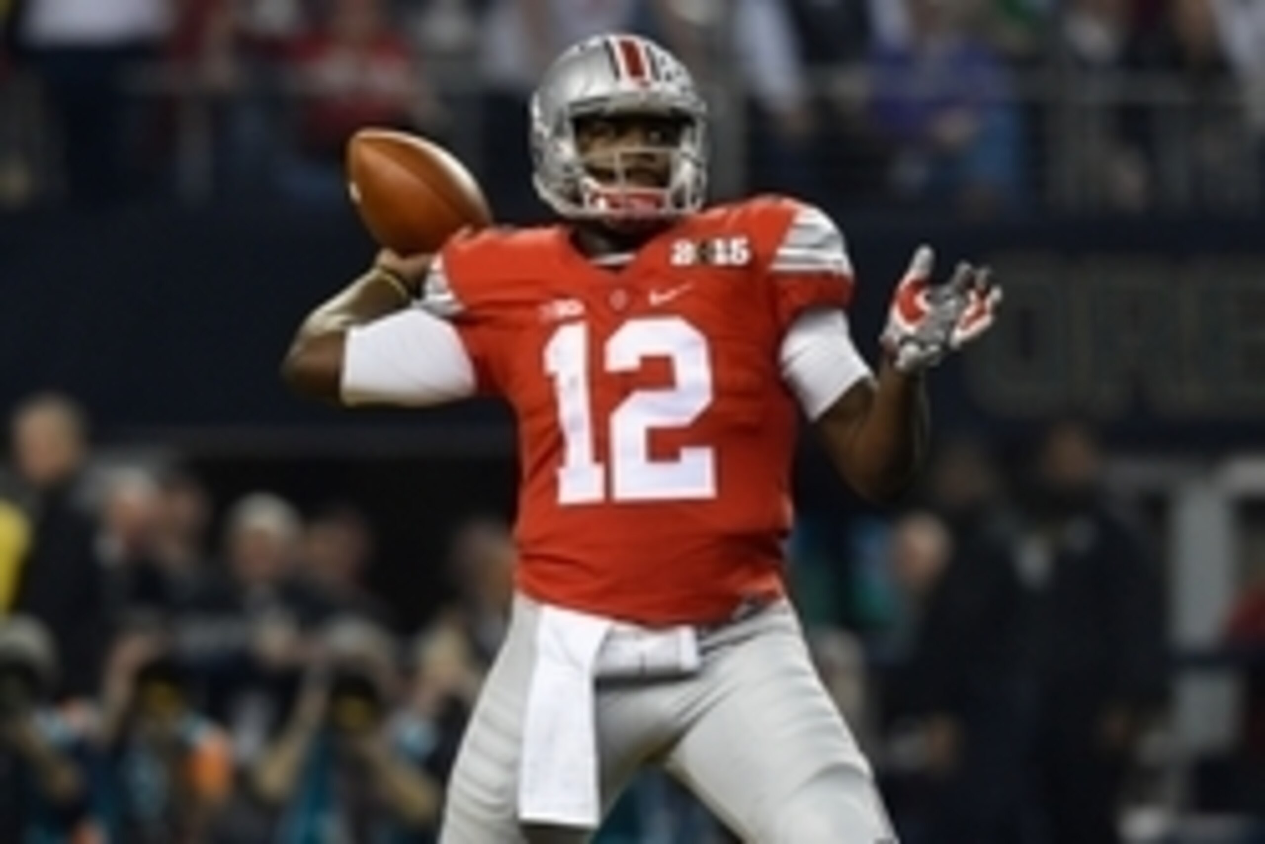 Jan 12, 2015; Arlington, TX, USA;Ohio State Buckeyes quarterback Cardale Jones (12) throws during the first quarter  in the 2015 CFP National Championship Game at AT&T Stadium. Ohio State Buckeyes defeated Oregon Ducks 42-20. Mandatory Credit: Tommy Gilli