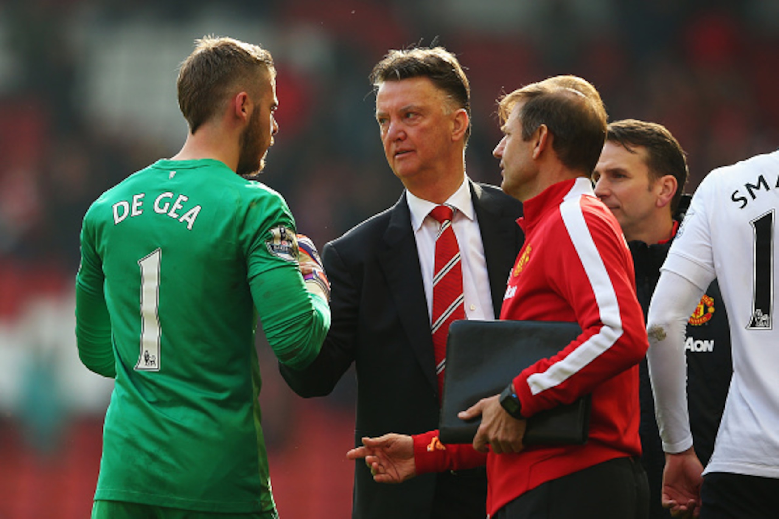 LIVERPOOL, ENGLAND - MARCH 22:  Louis van Gaal, manager of Manchester United celebrates victory with David De Gea of Manchester United after the Barclays Premier League match between Liverpool and Manchester United at Anfield on March 22, 2015 in Liverpoo