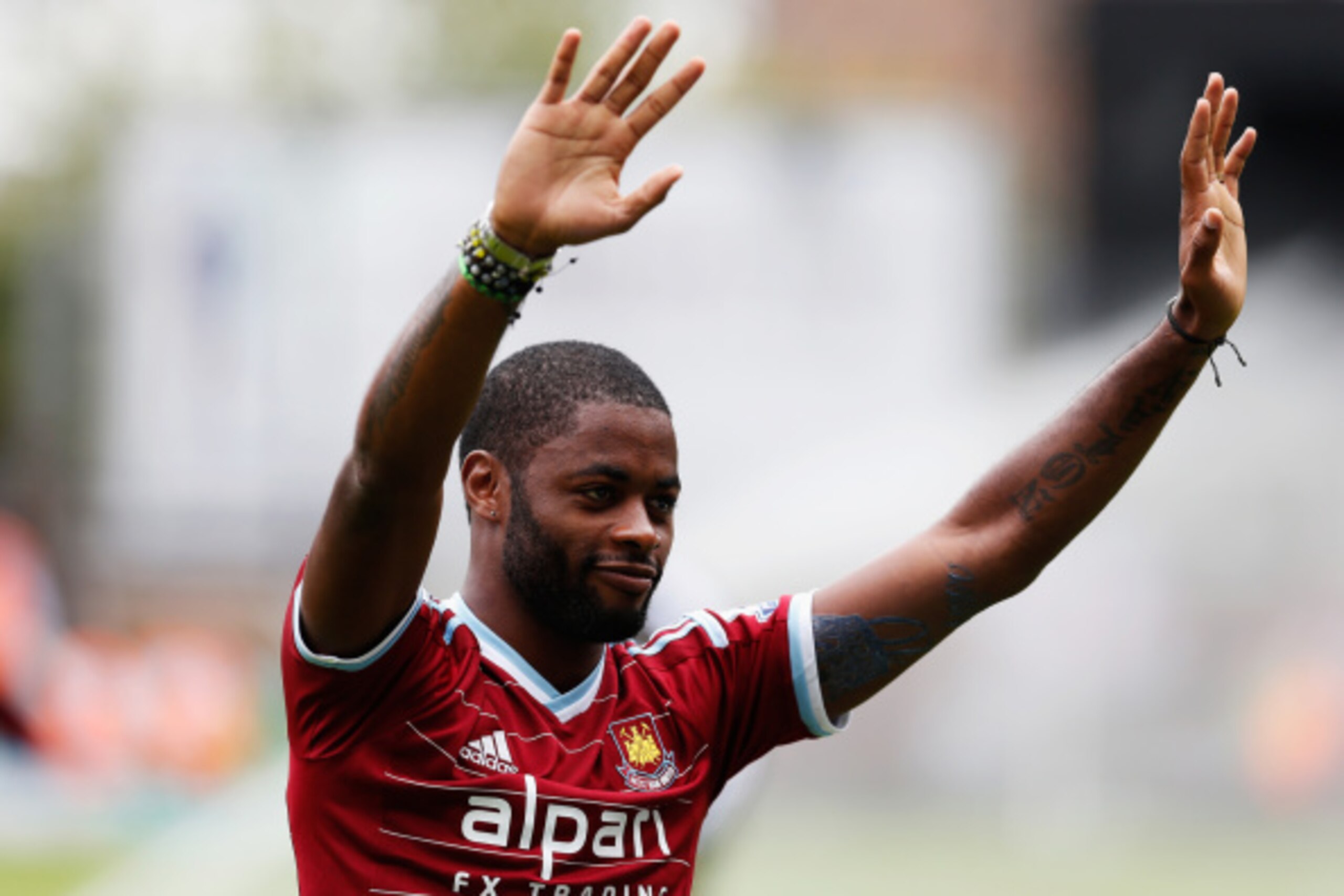LONDON, ENGLAND - AUGUST 30:  Alex Song of West Ham United acknowledges the fans as he joins the club on loan prior to the Barclays Premier League match between West Ham United and Southampton at Boleyn Ground on August 30, 2014 in London, England.  (Phot