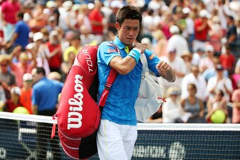 NEW YORK, NY - AUGUST 31:  Kei Nishikori of Japan walks off of the court after losing against Benoit Paire of France during their Men's Single First Round match on Day One of the 2015 US Open at the USTA Billie Jean King National Tennis Center on August 3