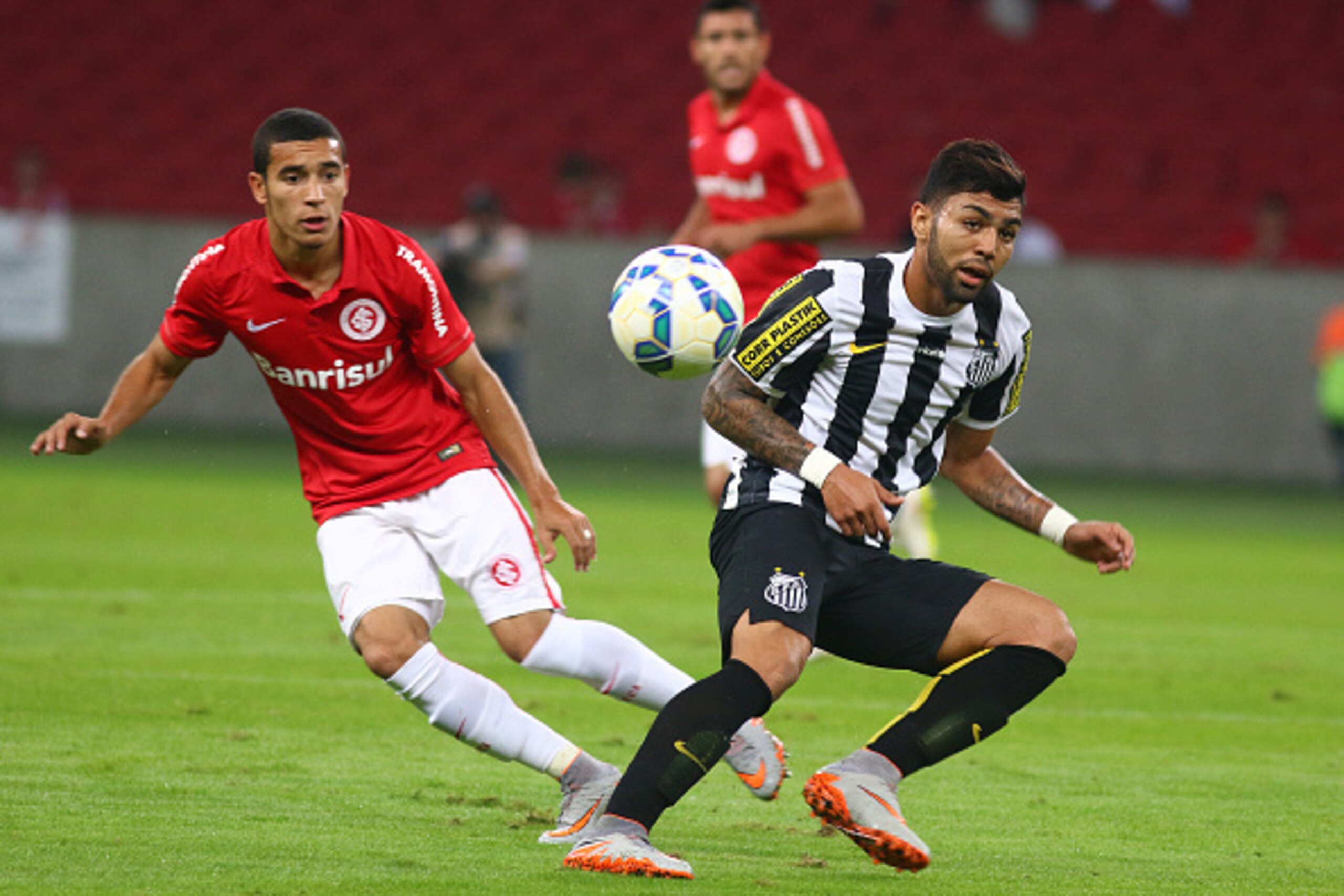 PORTO ALEGRE, BRAZIL - JUNE 28: Willian of Internacional battles for the ball against Gabriel of Santos during the match between Internacional and Santos as part of Brasileirao Series A 2015, at Estadio Beira-Rio on June 28, 2015, in Porto Alegre, Brazil.