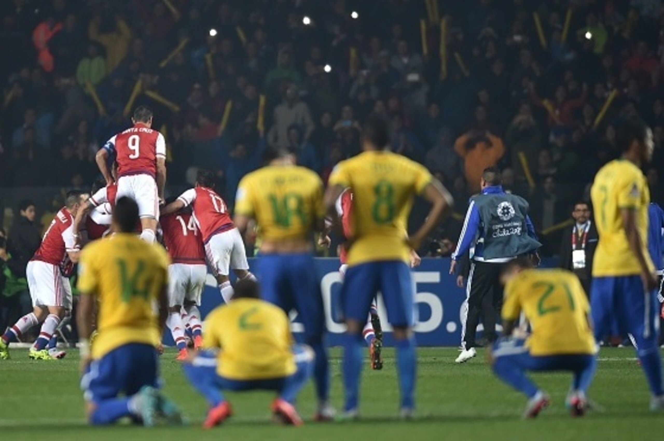 Paraguay's players celebrate after defeating Brazil in the penalty shoot-out of their 2015 Copa America football championship quarter-final match, in Concepcion, Chile, on June 27, 2015. AFP PHOTO / YURI CORTEZ (Photo credit should read YURI CO Paraguay's players celebrate after defeating Brazil in the penalty shoot-out of their 2015 Copa America football championship quarter-final match, in Concepcion, Chile, on June 27, 2015. AFP PHOTO / YURI CORTEZ (Photo credit should read YURI CO