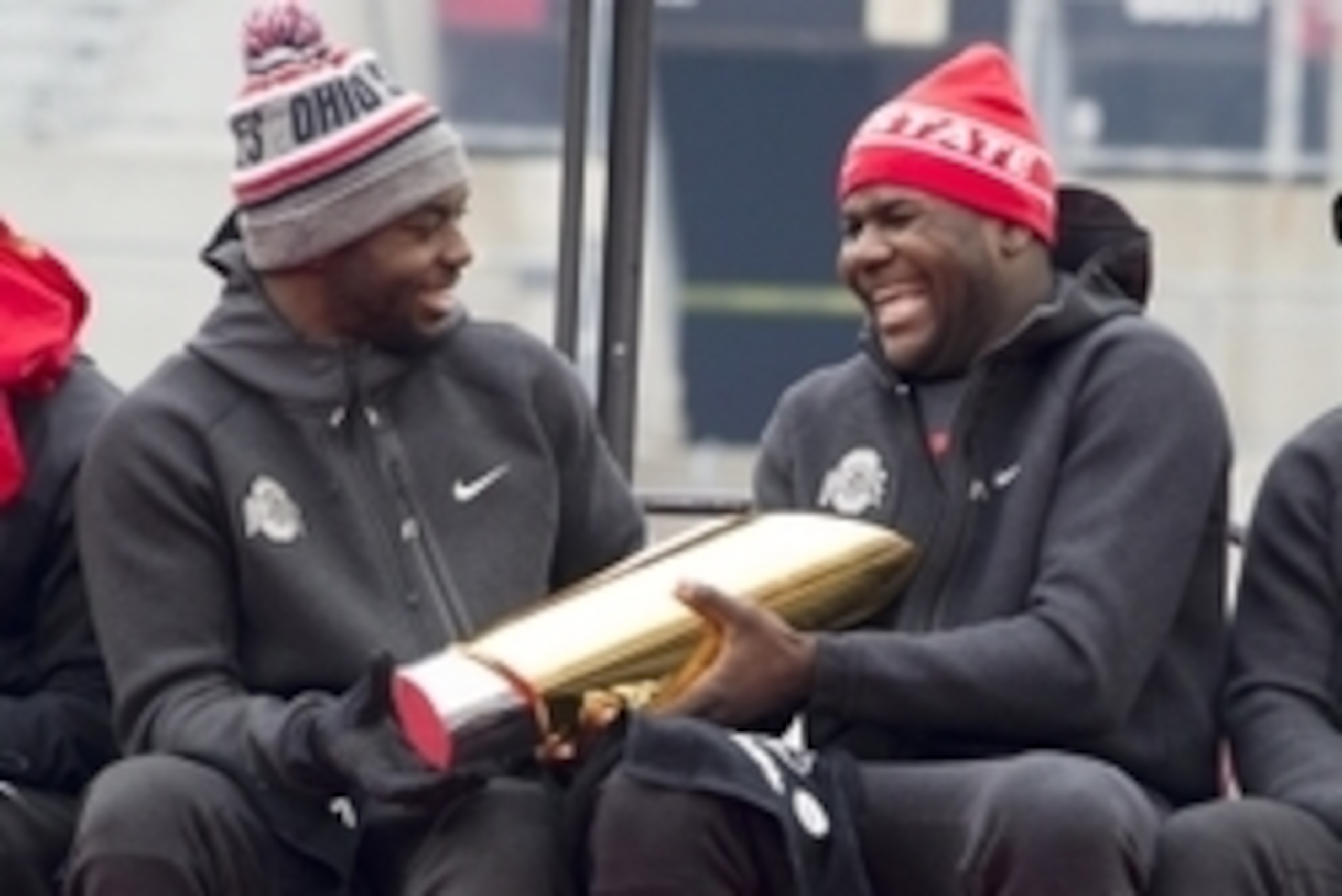 Jan 24, 2015; Columbus, OH, USA; Ohio State Buckeyes quarterback J.T. Barrett (16) hands the National Championship trophy to quarterback Cardale Jones (12) during the National Championship celebration at Ohio Stadium. Mandatory Credit: Greg Bartram-USA TO