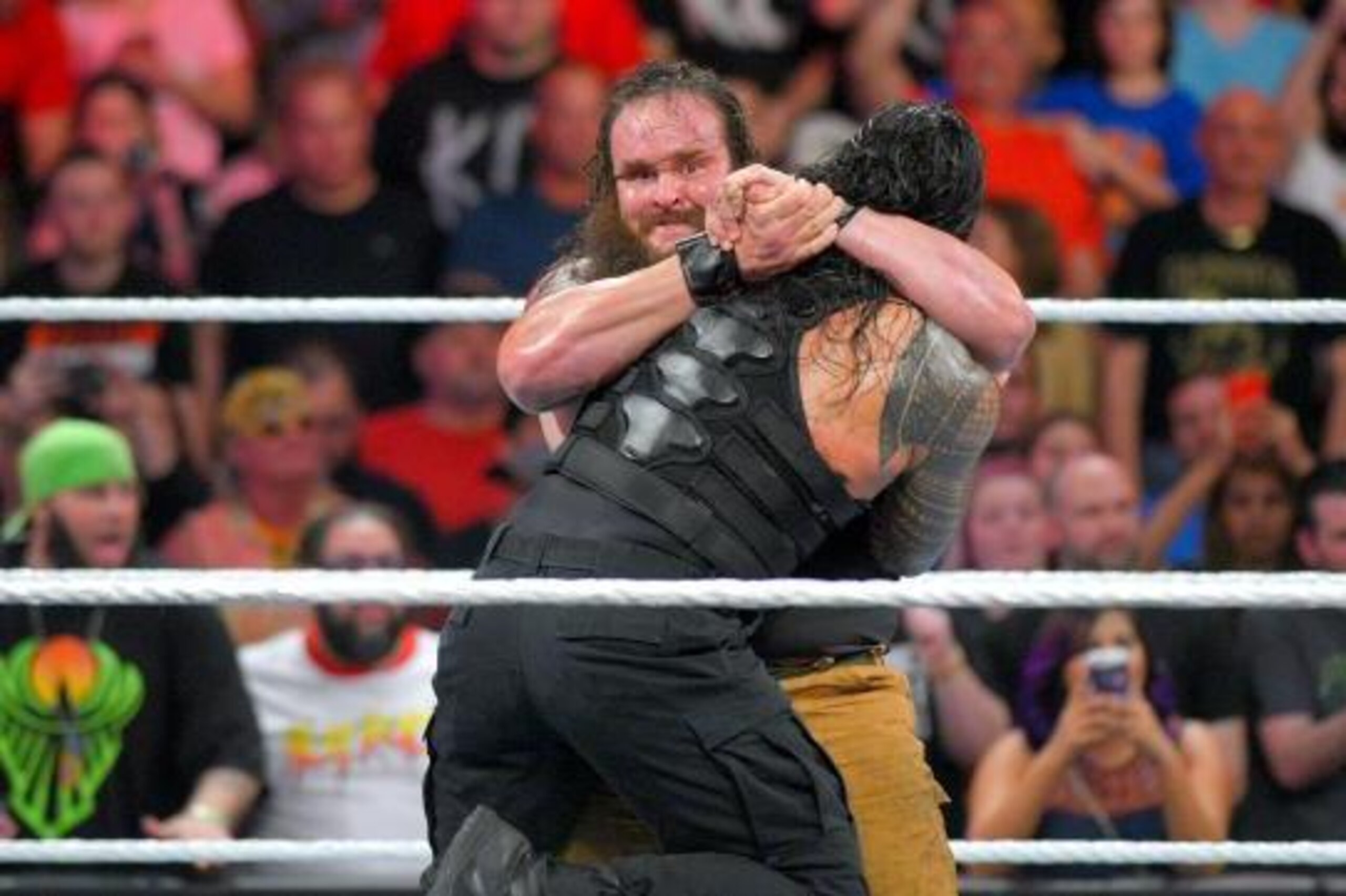 Braun Strowman attacks Roman Reigns after his in-ring debut.